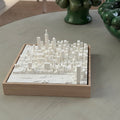 3D city map wall art in a wooden frame on a table, modern home decor