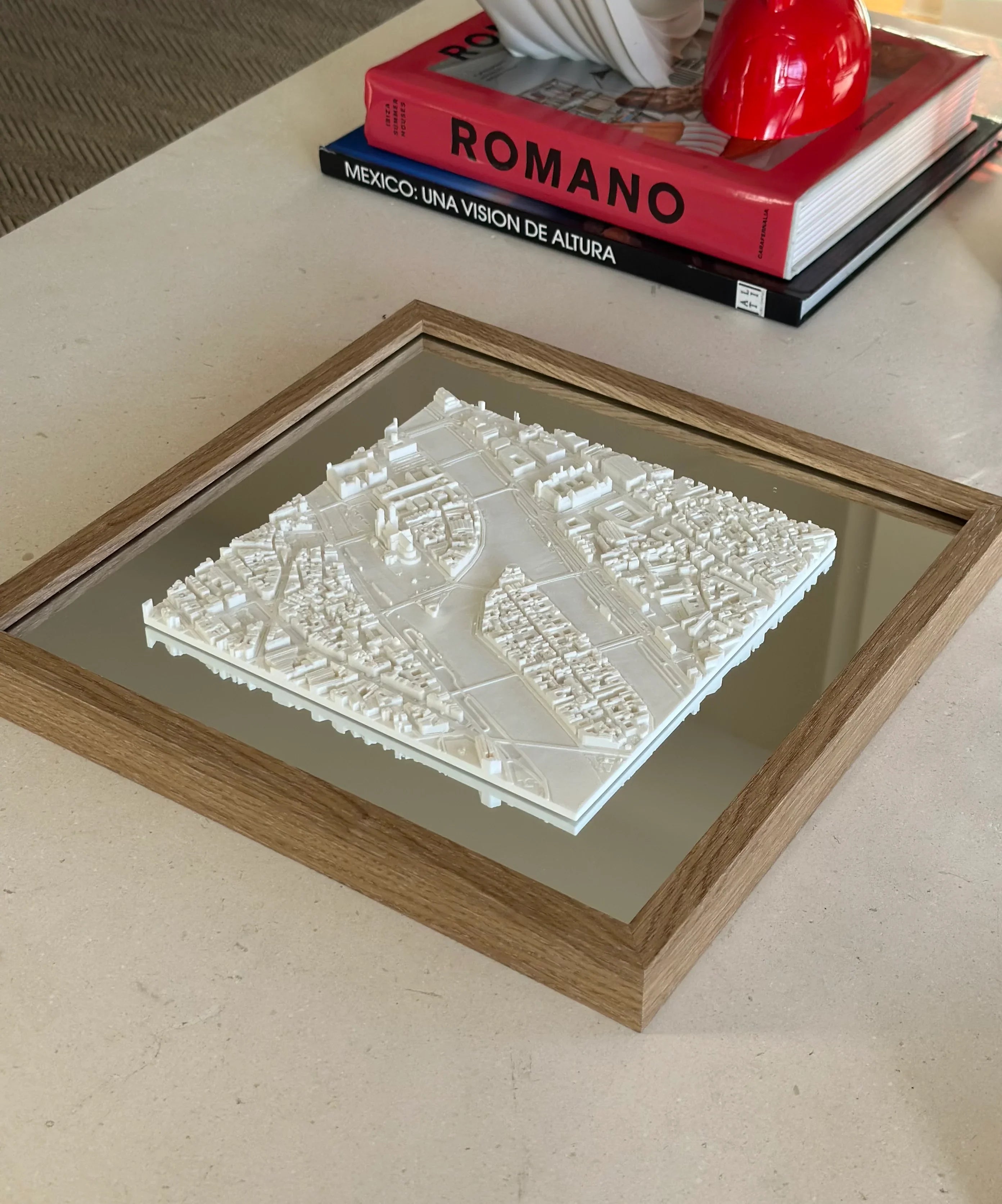 3D city map wall art in a wooden frame on a modern table, travel decor accent