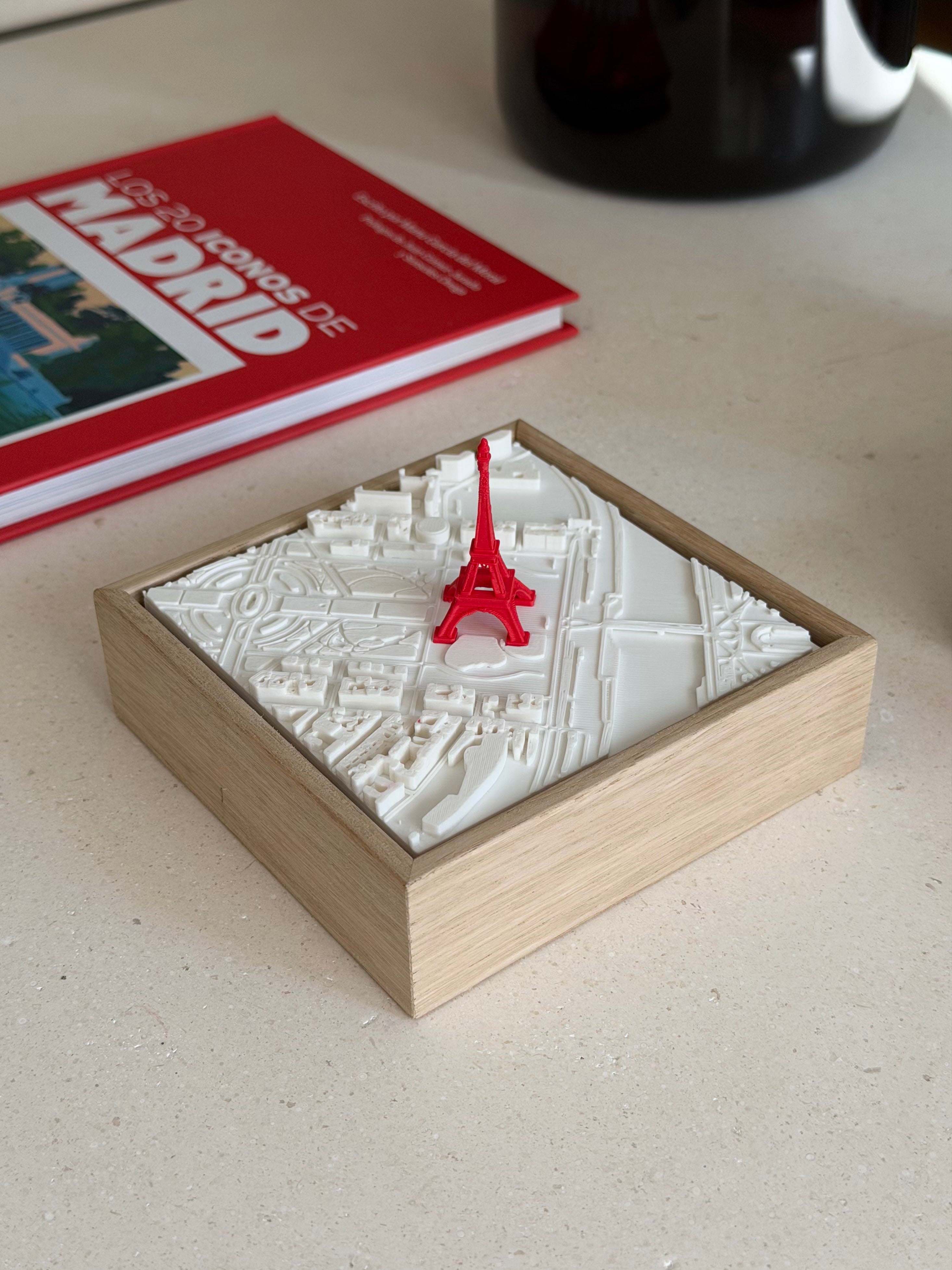 3D city map of Paris with red Eiffel Tower, wooden frame, modern decorative art