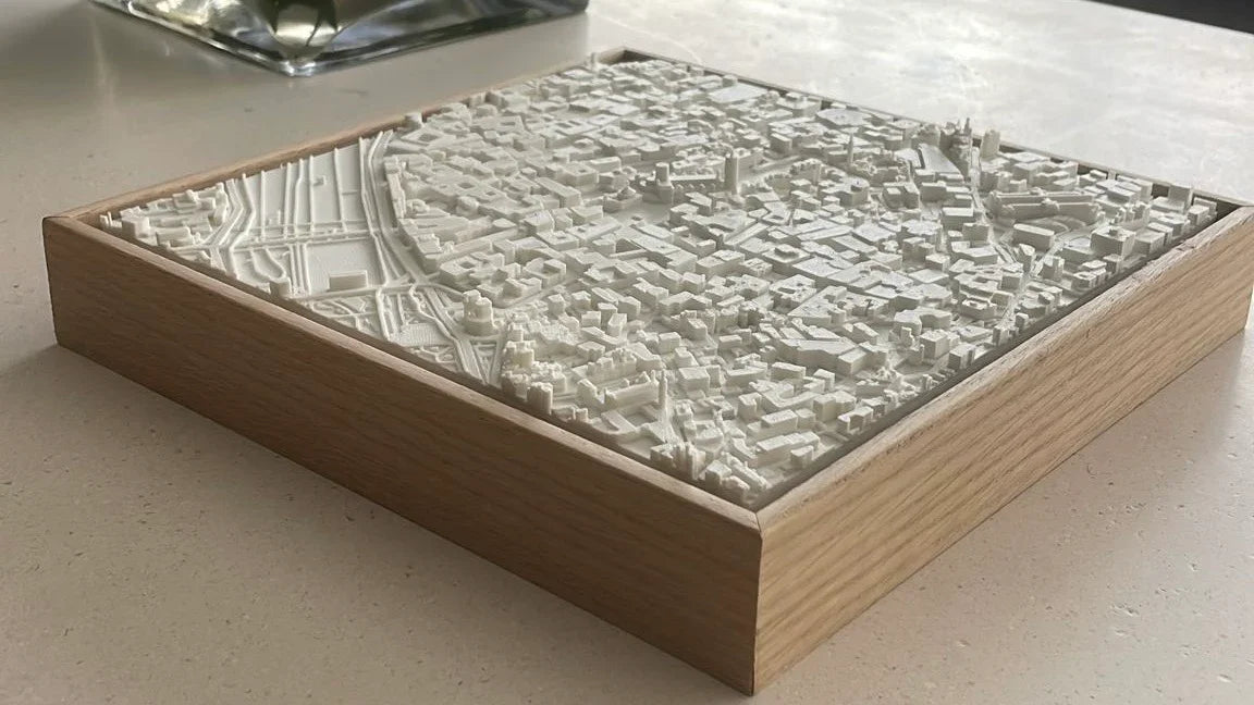 3D city map wall art in a wooden frame, detailed architectural model decor