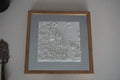 Framed 3D city map wall art with intricate white buildings and streets, modern home decor