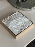 Modern 3D city map wall art with topographic details in a wooden frame on a table