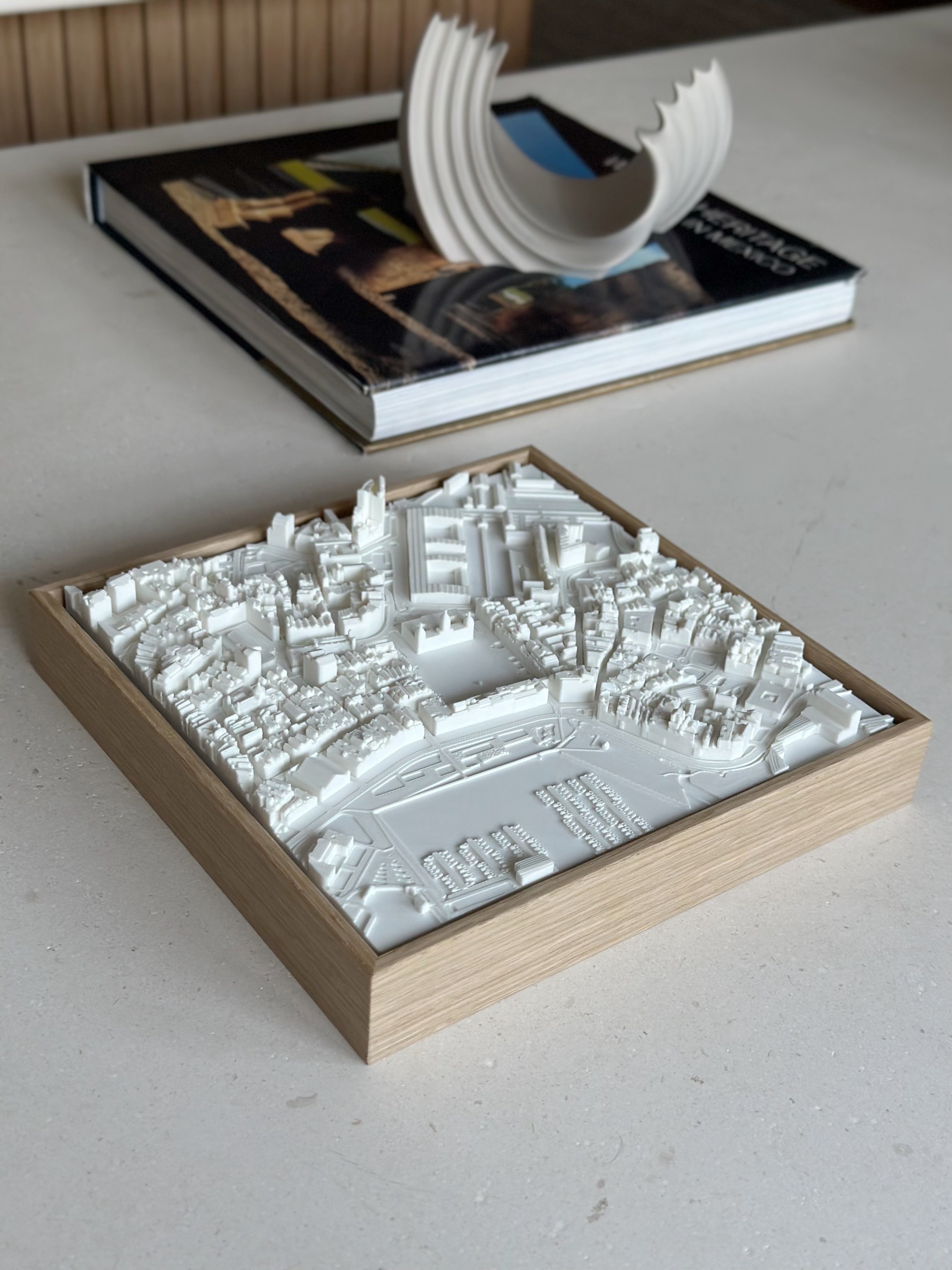 3D city map artwork in a wooden frame on a table, modern home decor for travelers