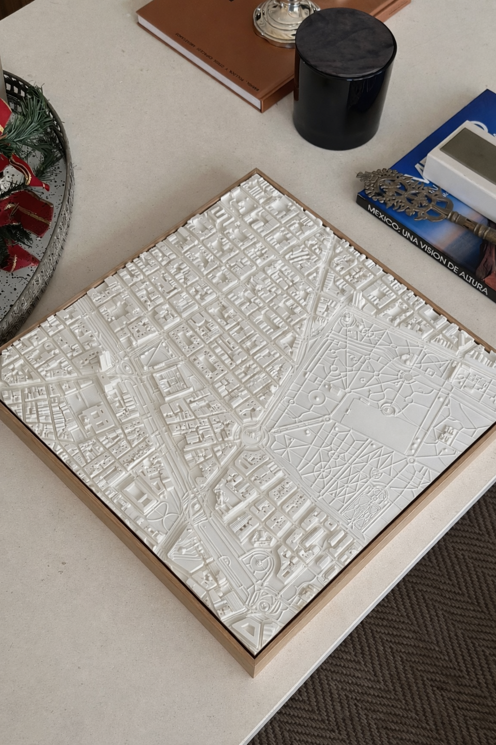 3D city map wall art with detailed streets and buildings on a modern coffee table