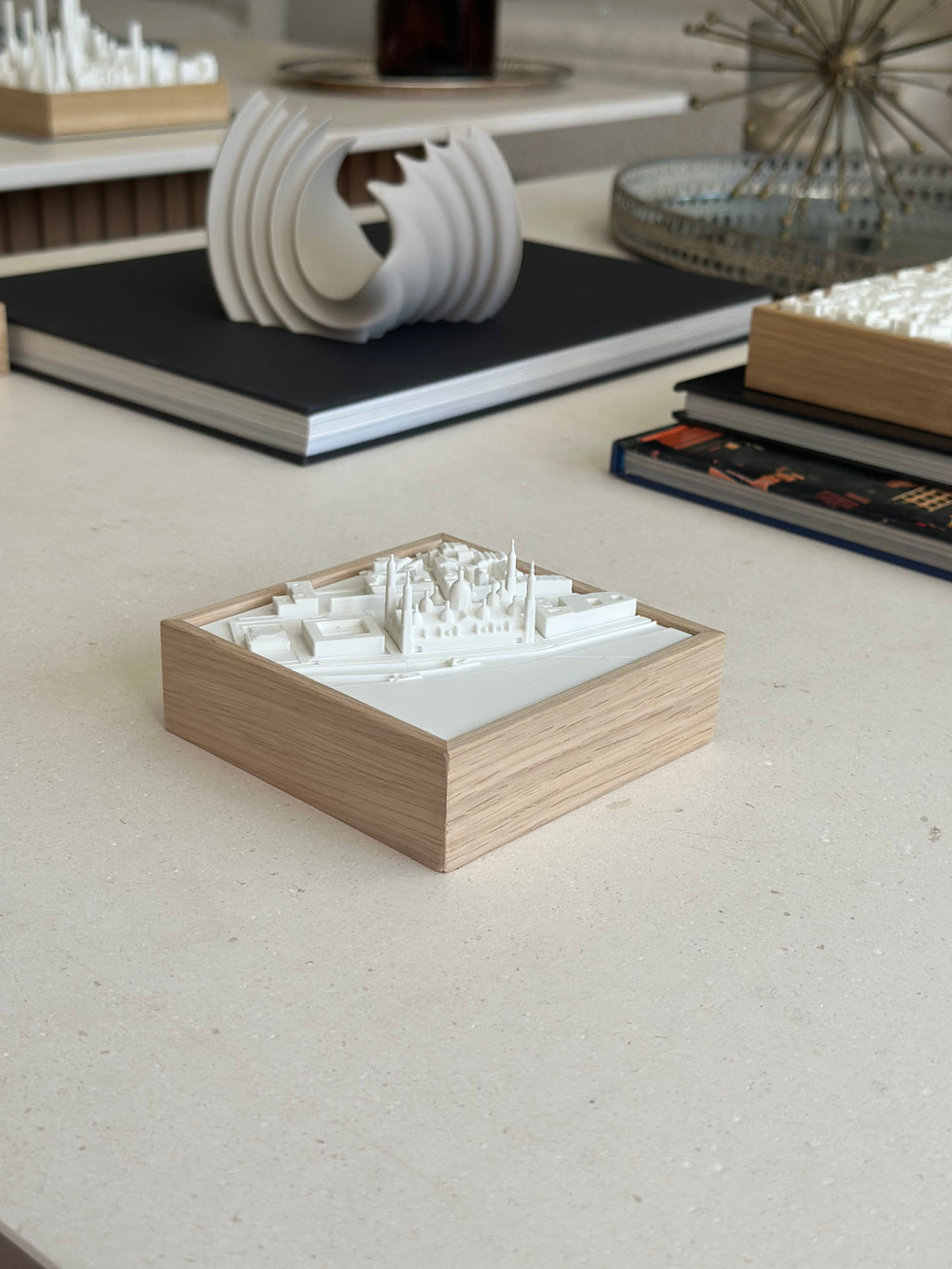 3D city map wall art in white with wooden frame on modern decor table