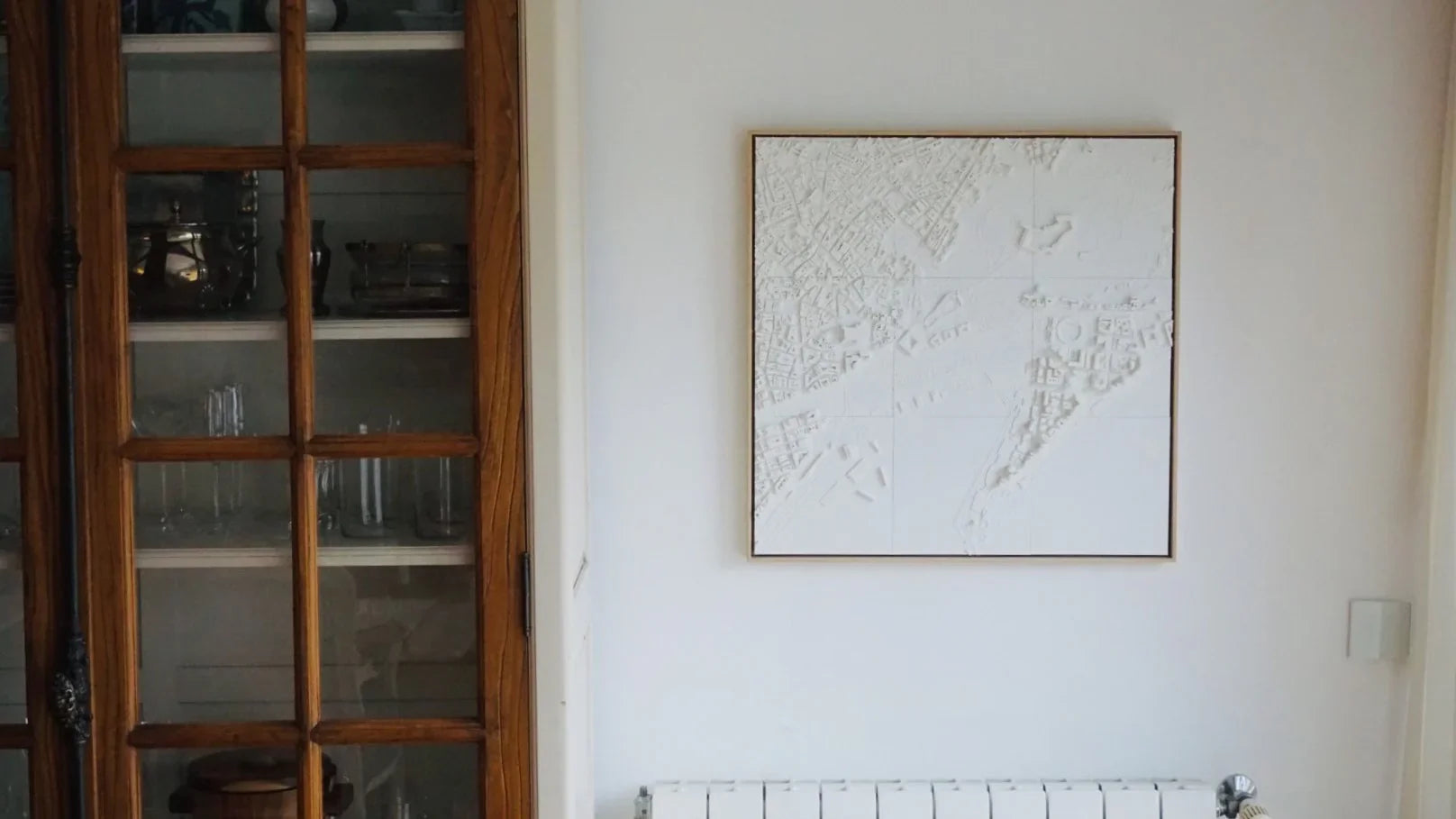 Framed 3D city map wall art with textured white details, modern home decor.