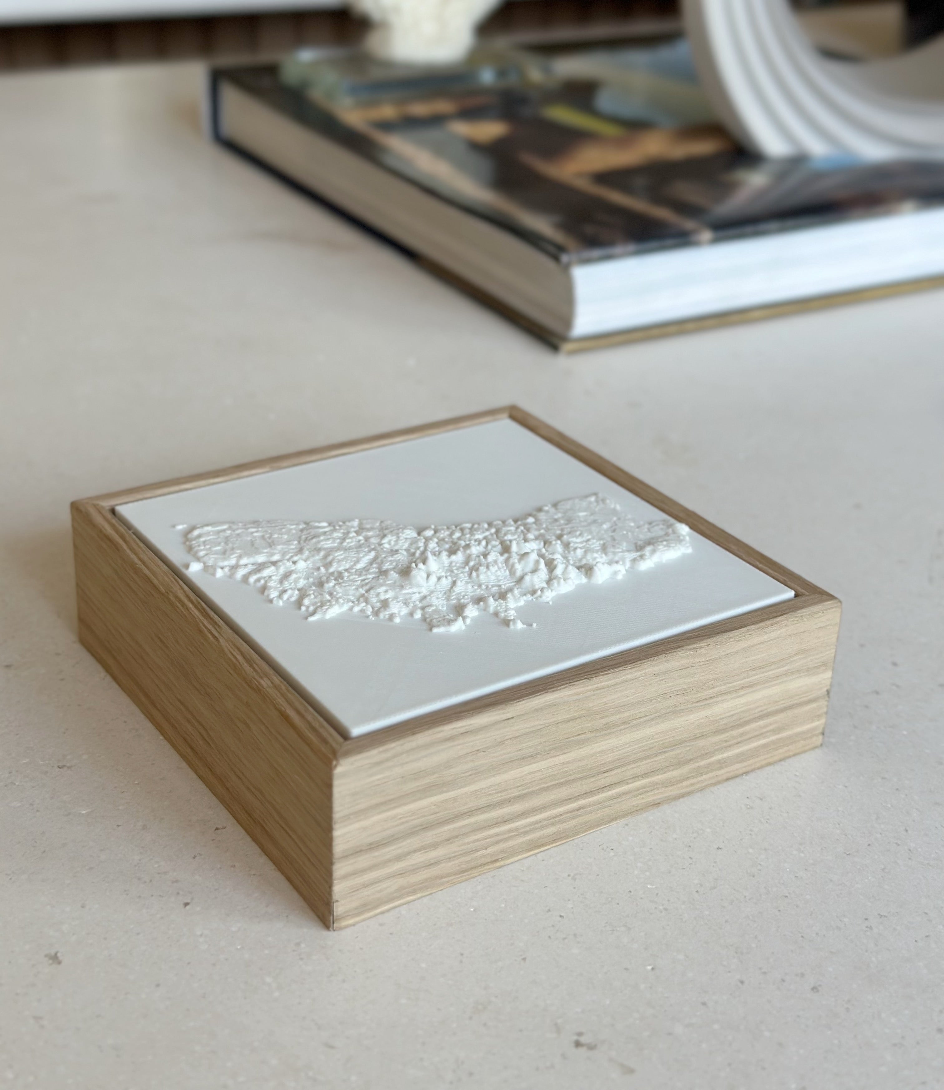 Modern 3D city map art in a wooden frame, decorative wall decor on table