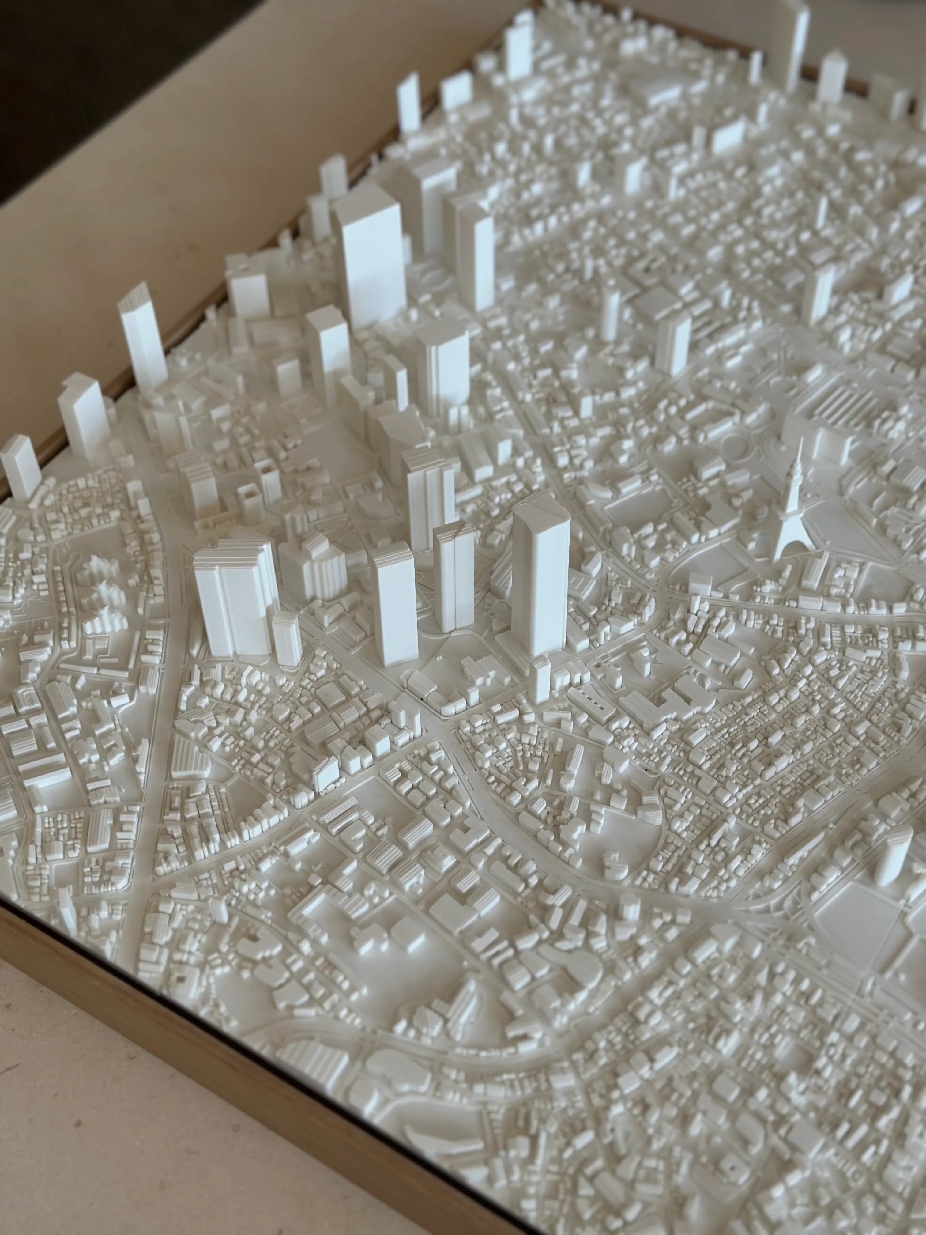 White 3D city map wall art with detailed buildings and streets, modern urban decor