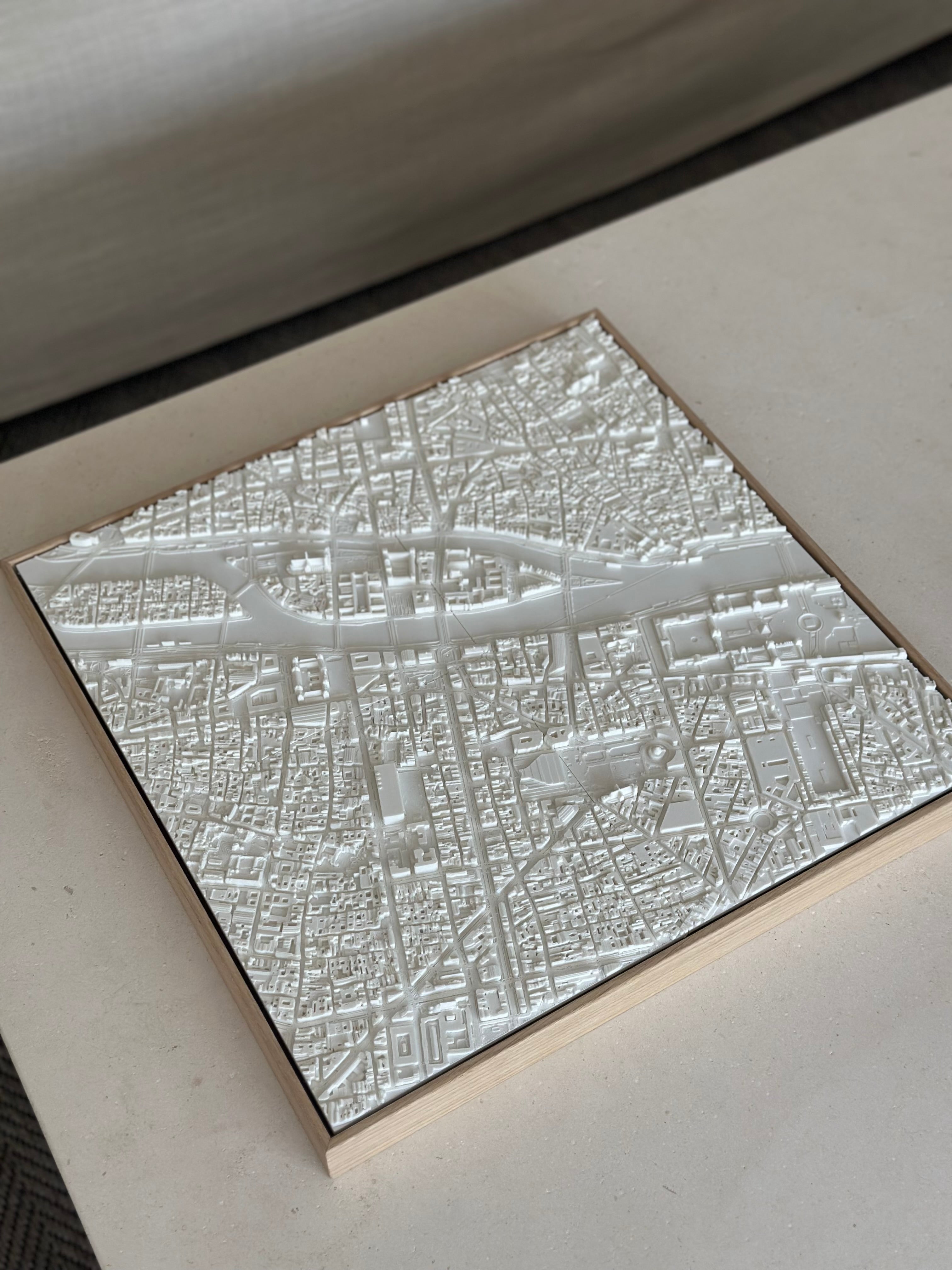 3D city map wall art in white with detailed urban streets and buildings on a square frame