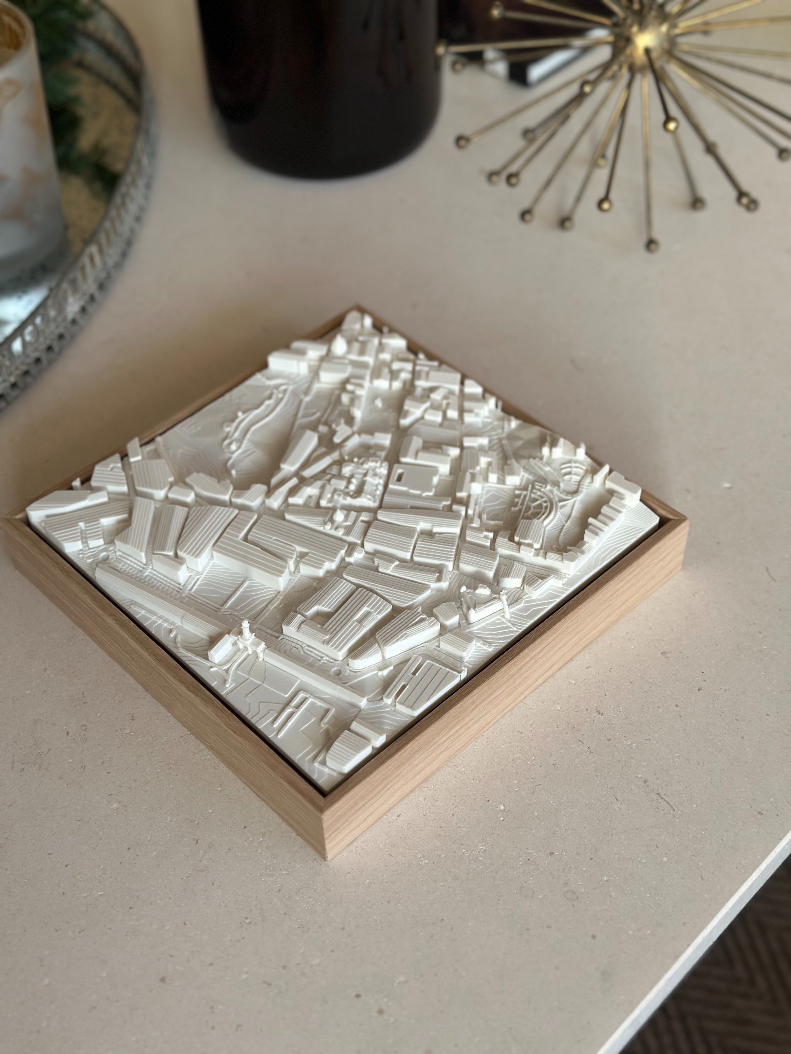 3D city map wall art in a wooden frame, modern city map decor on a tabletop