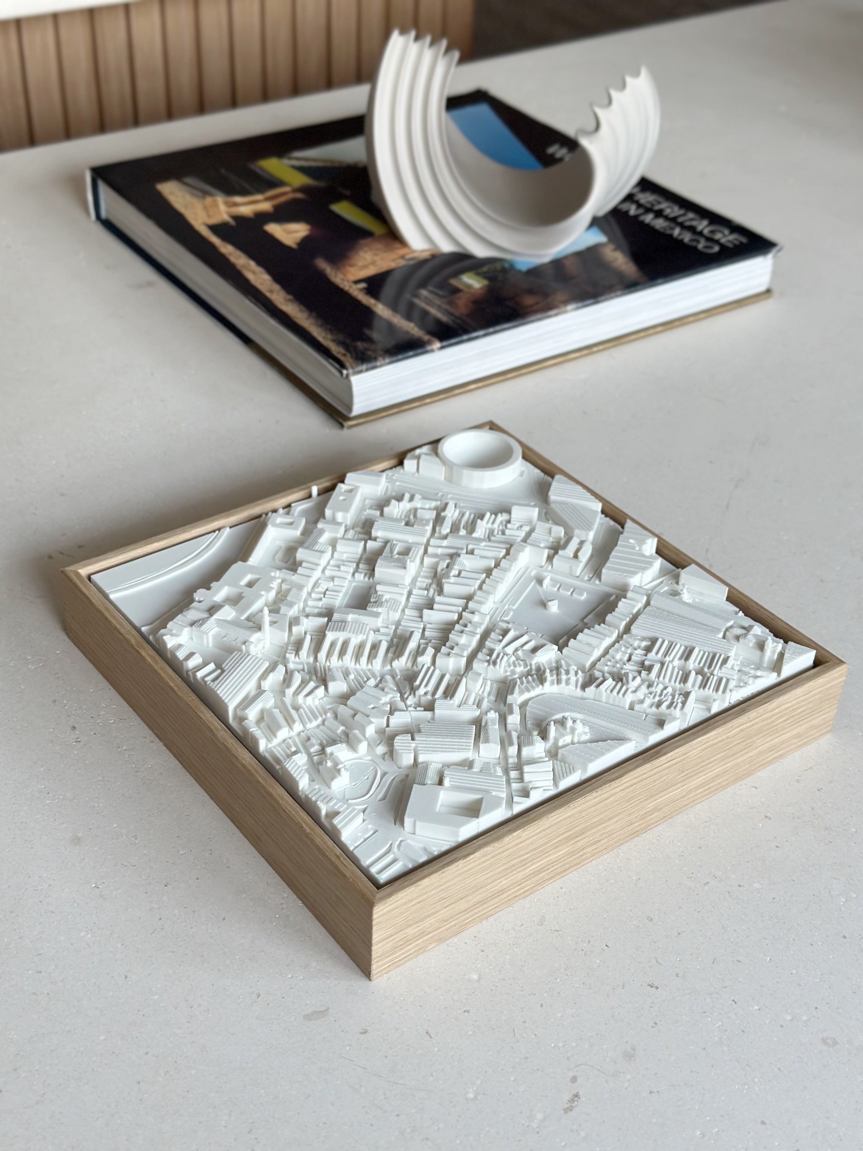3D city map artwork in a wooden frame on a modern table, decorative gift for travelers