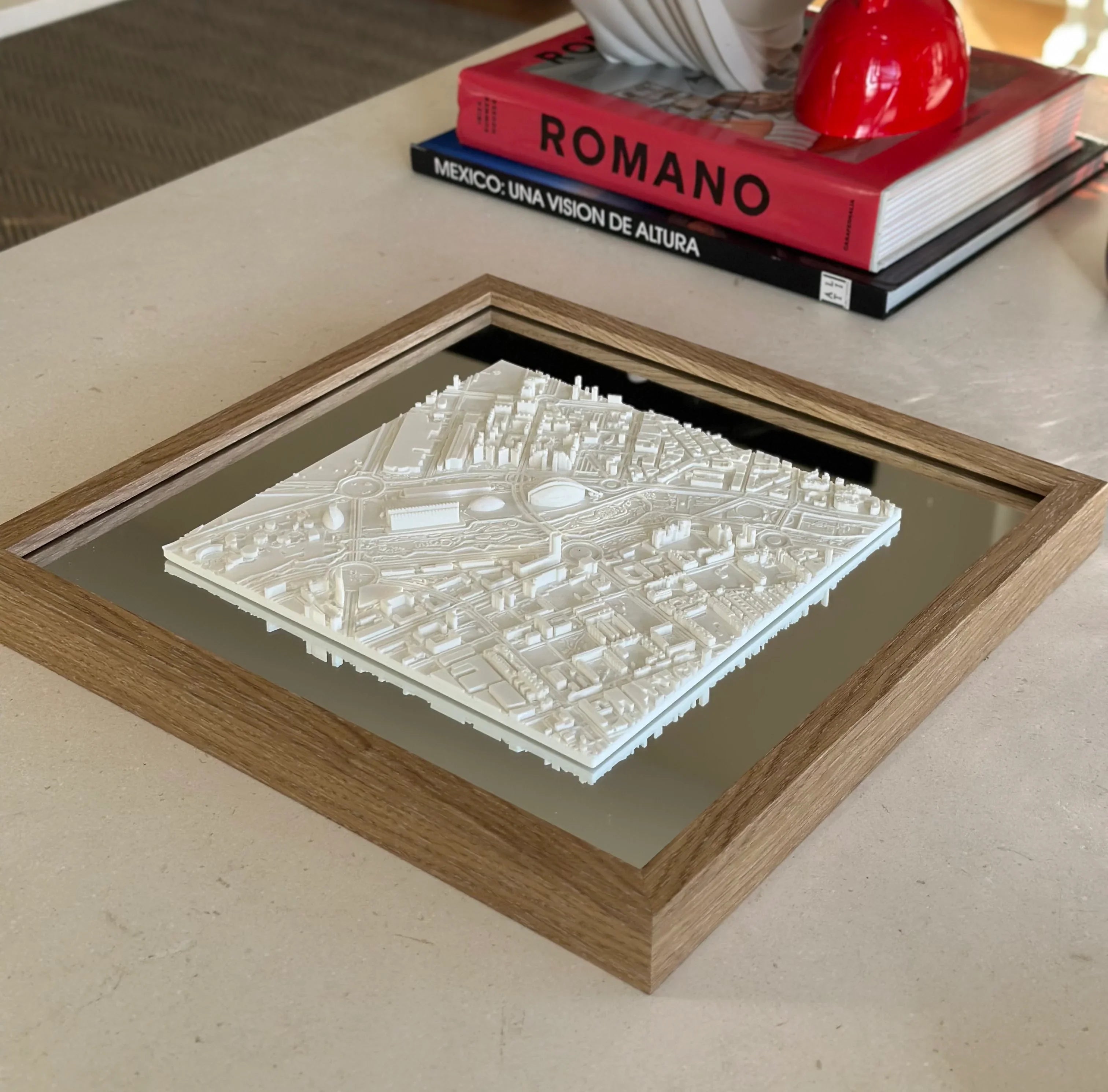 3D city map wall art in a wooden frame on a modern table, decorative urban map design