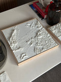 3D city map wall art in a wooden frame on a modern table, decorative and detailed