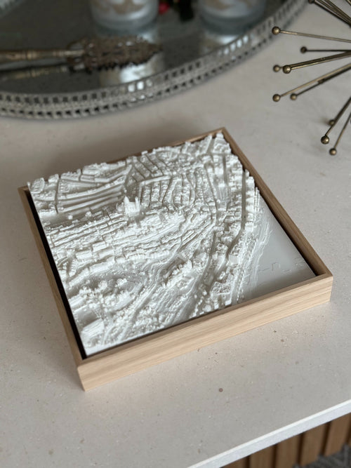 3D city map wall art in a wooden frame on a modern table, home decor accent
