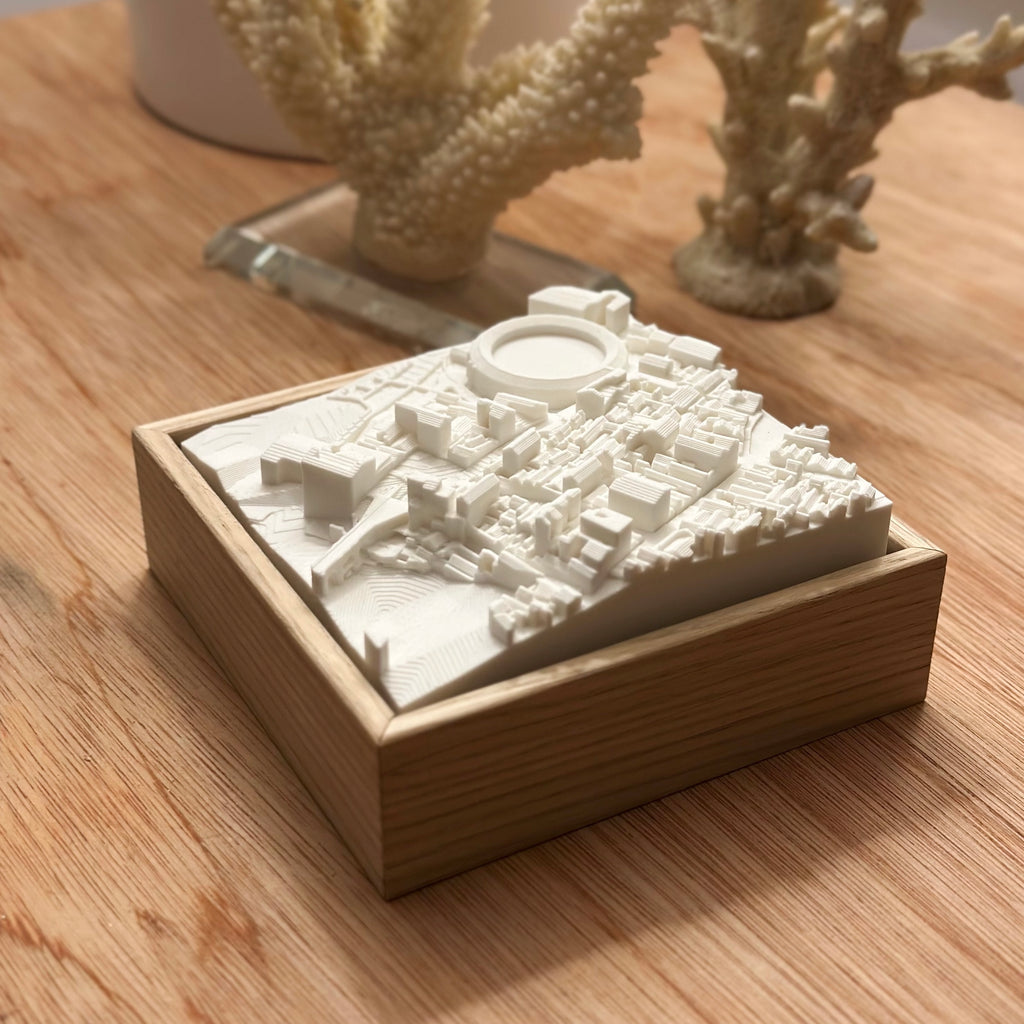 3D city map wall art in white frame, decorative wooden desk, modern home decor