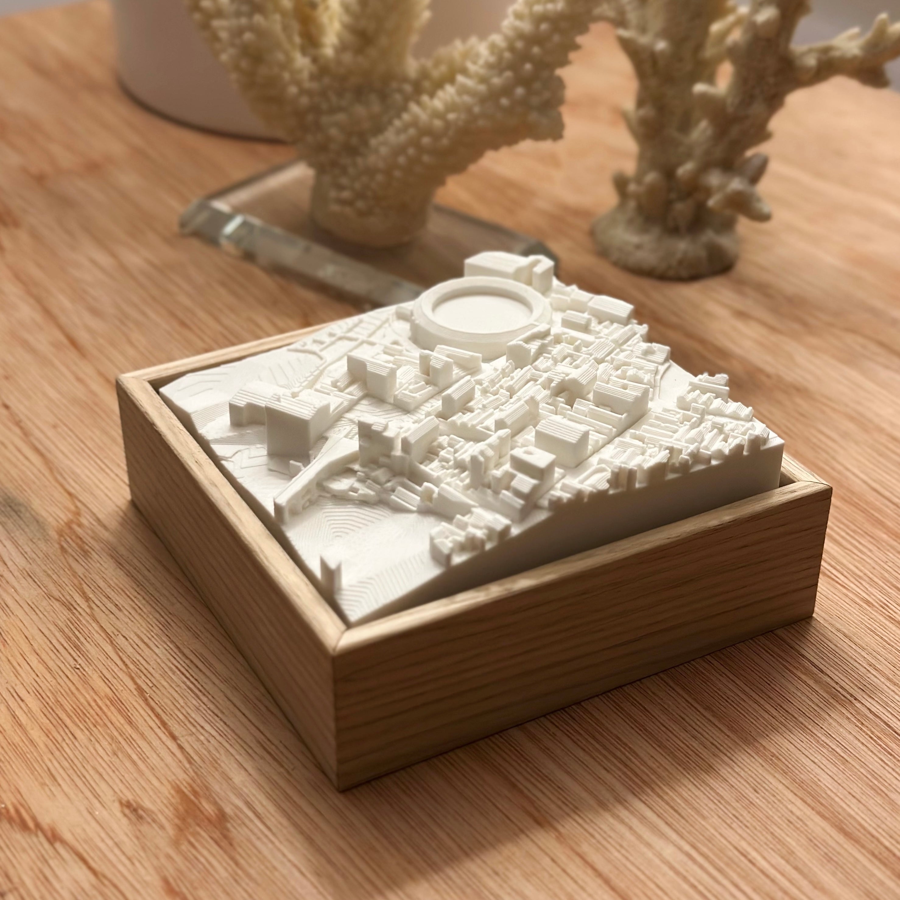 3D city map wall art in white frame, decorative wooden desk, modern home decor