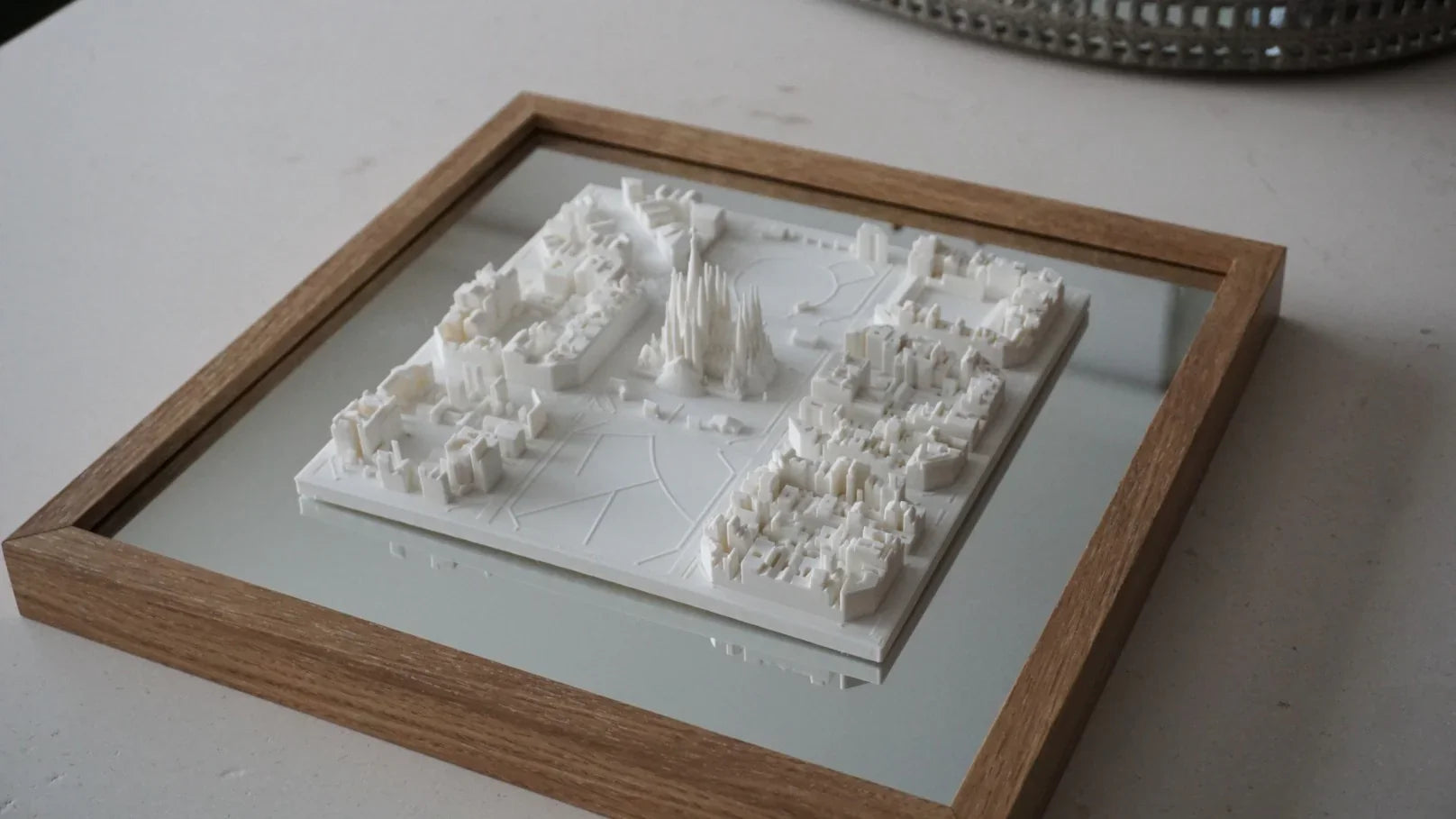 3D city map wall art with white miniature buildings in a wooden frame, decorative gift