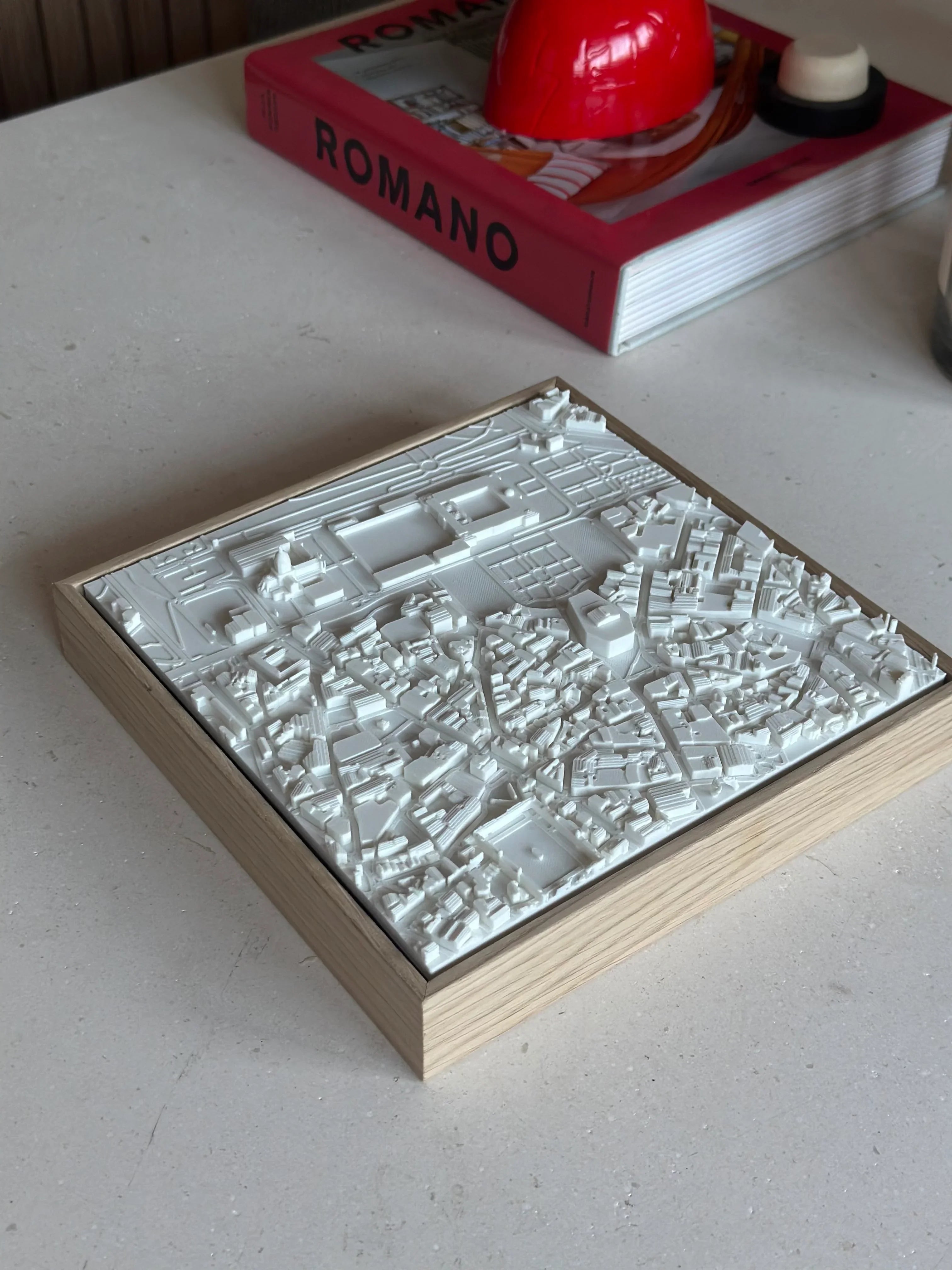 3D city map wall art in white frame on minimalist table, modern urban decor