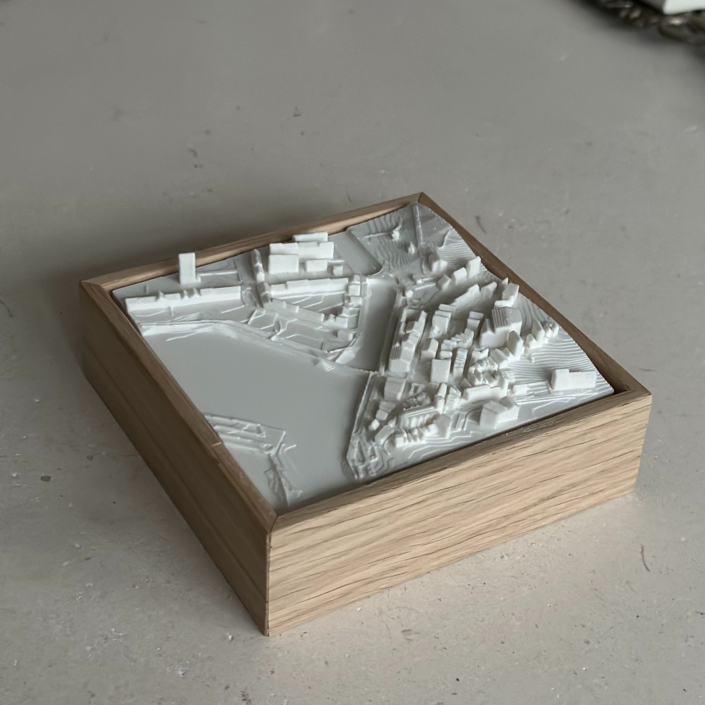 3D city map wall art in a wooden frame, minimalist urban decor piece