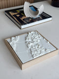 3D city map wall art in a wooden frame on a modern table, stylish home decor accent