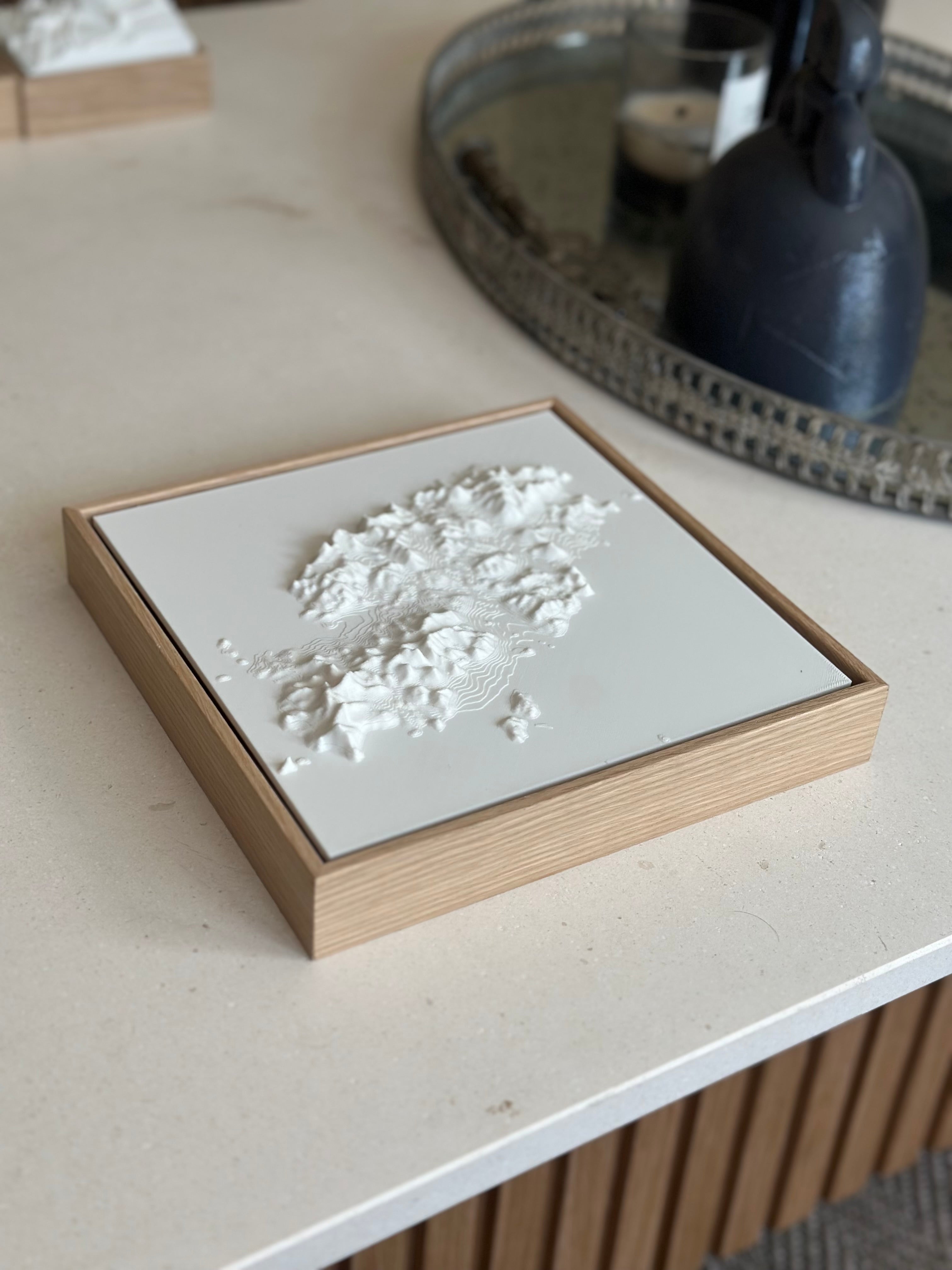 3D city map wall art in a wooden frame on a modern table, decorative home design