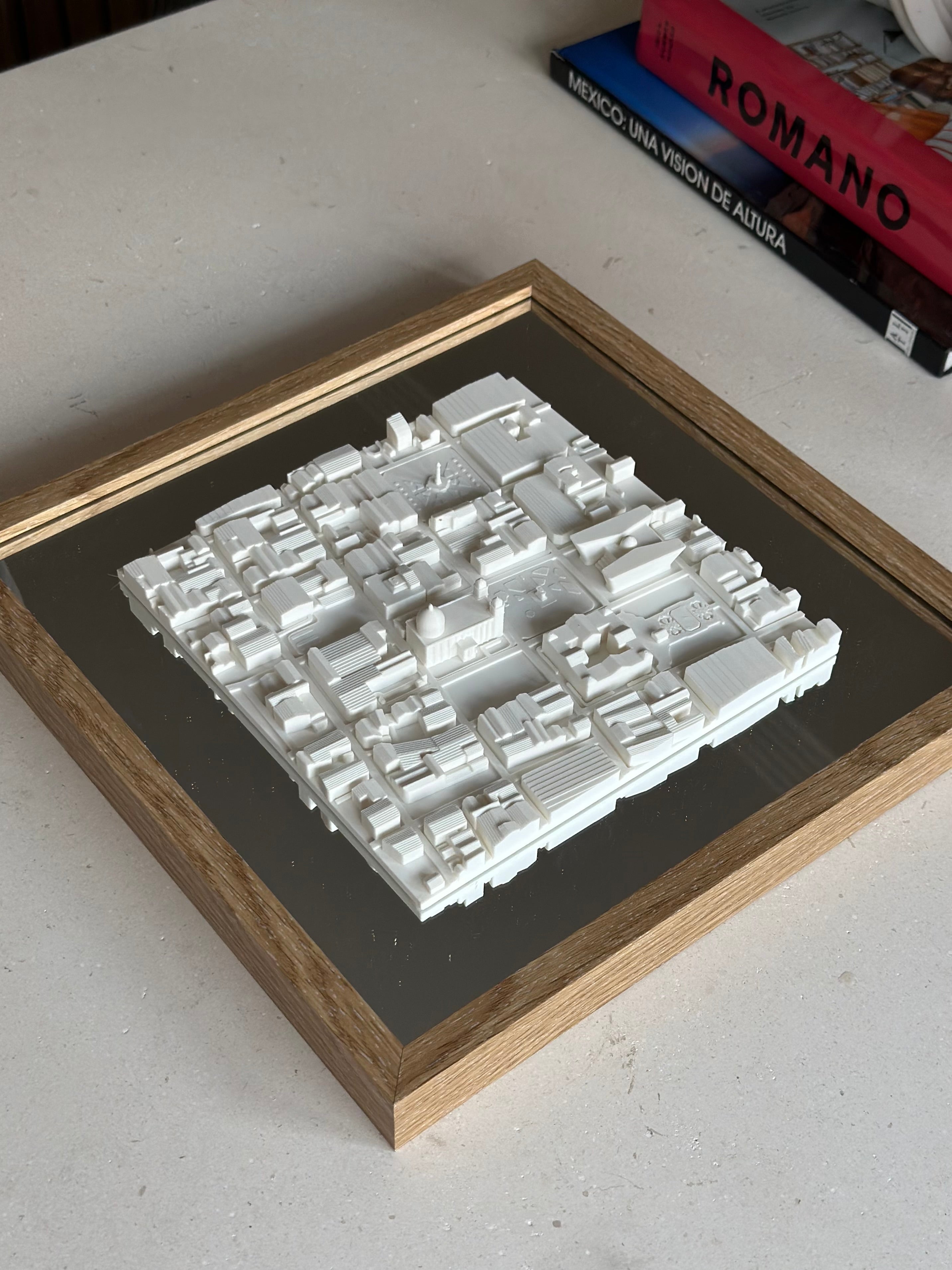 3D city map wall art in wooden frame on a table, modern cityscape decor