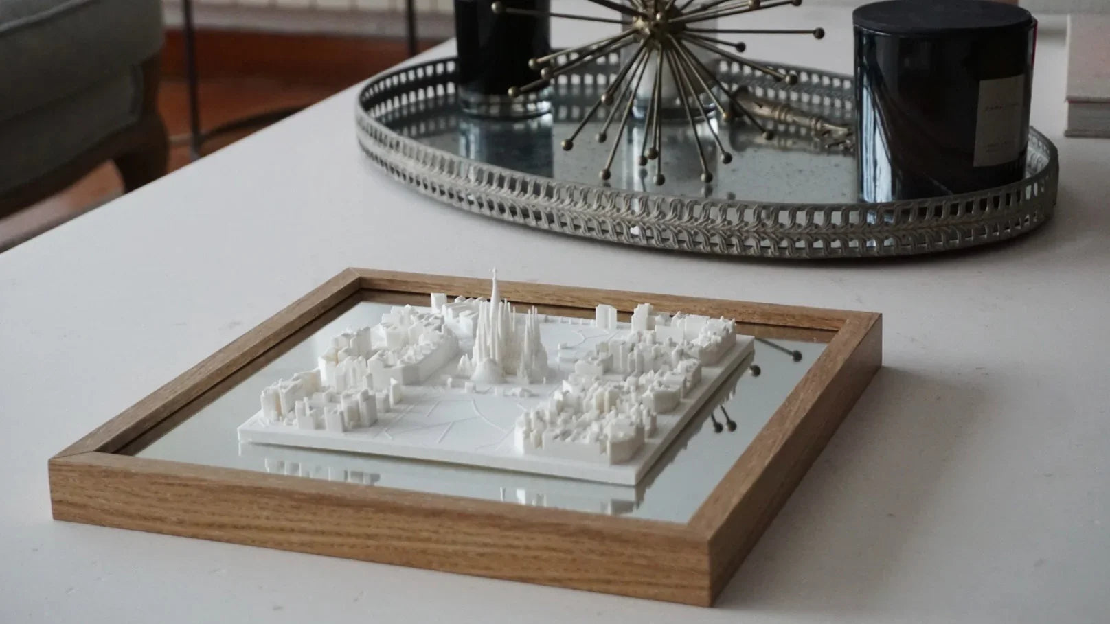 3D city map wall art in wooden frame displayed on a modern coffee table, home decor