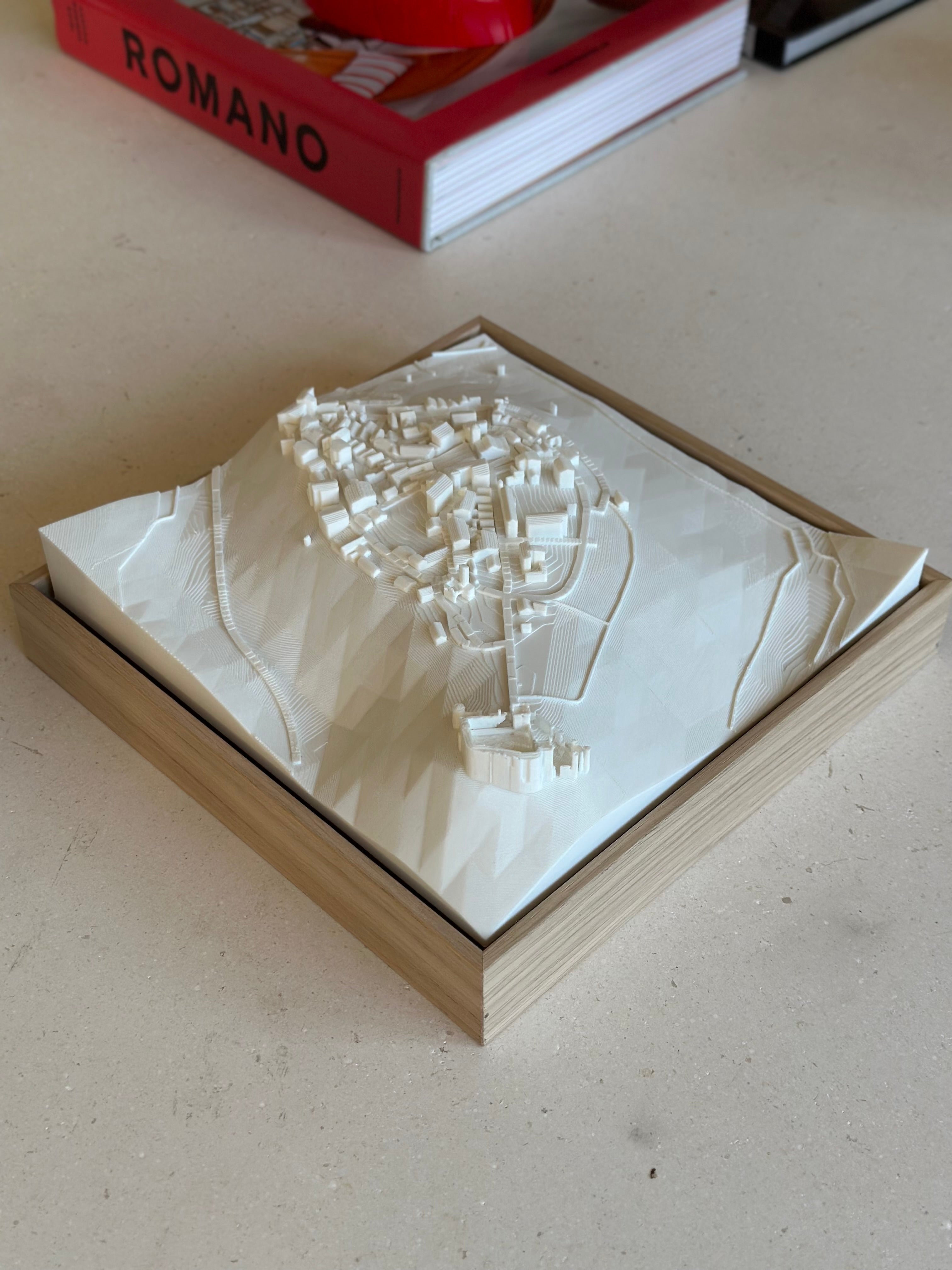 3D city map wall art in a wooden frame, minimalist modern decor on table