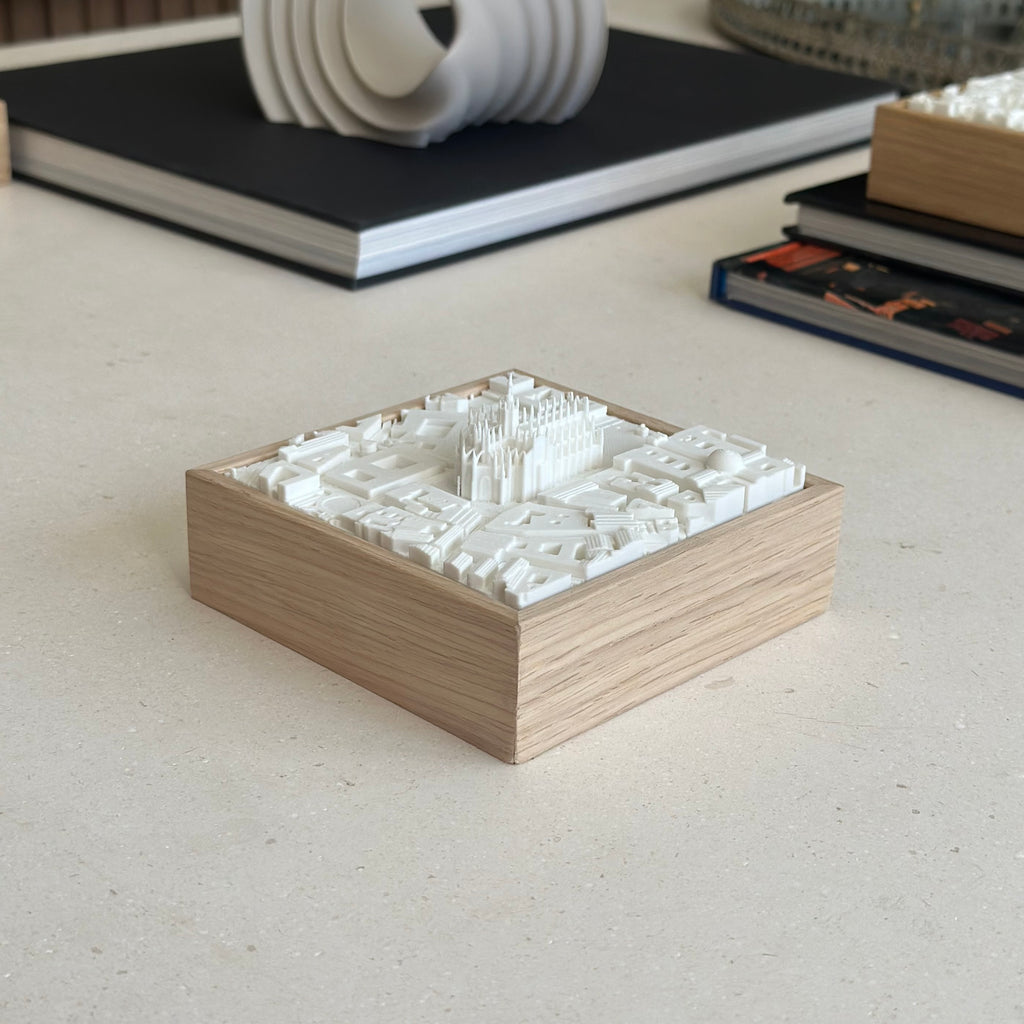 3D city map artwork with wooden frame on a minimalist table, modern home decor