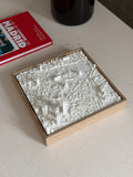 3D Madrid city map art in a wooden frame on a table, modern decorative wall piece
