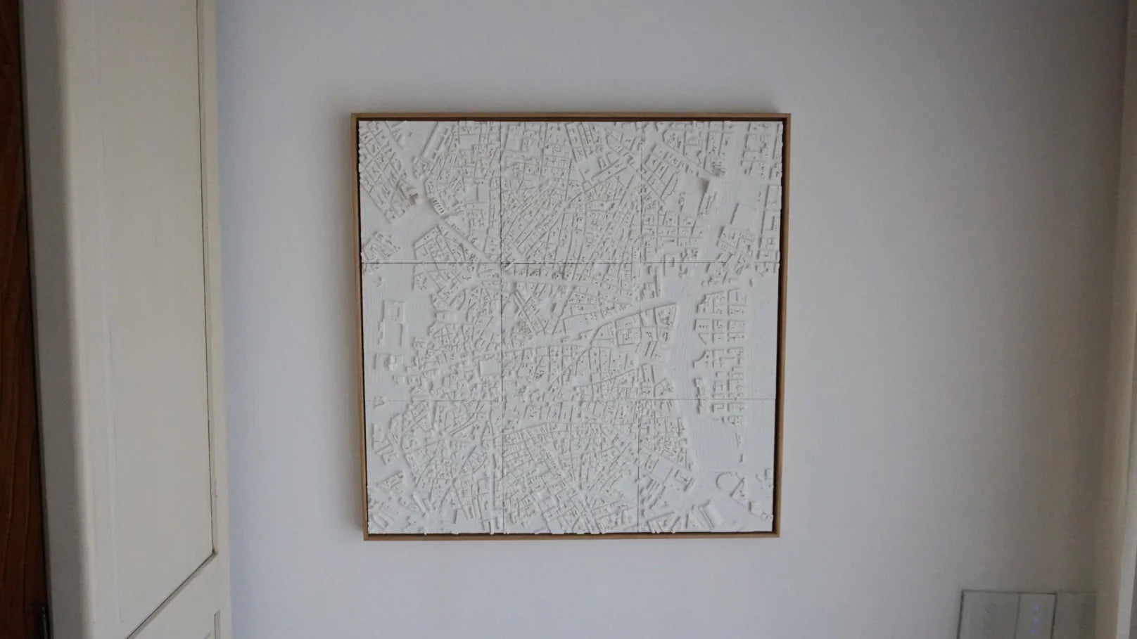 White 3D city map wall art in a wooden frame, minimalist home decor