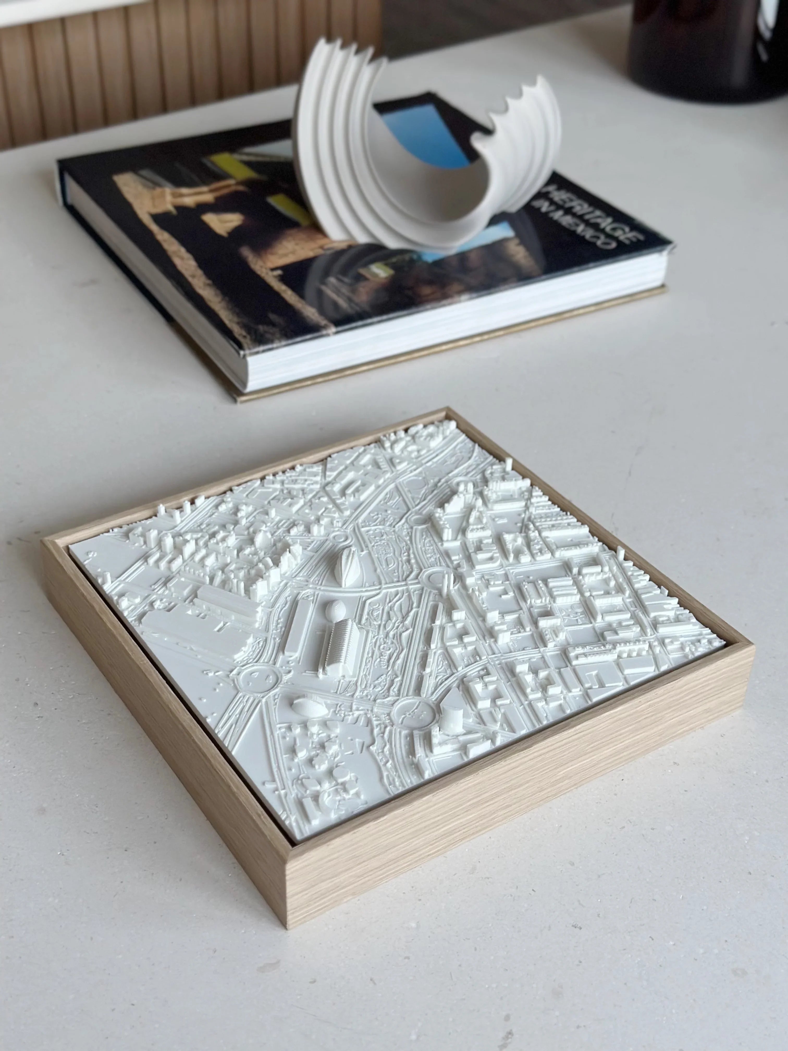 3D city map wall art in wooden frame on a modern table, decorative urban design