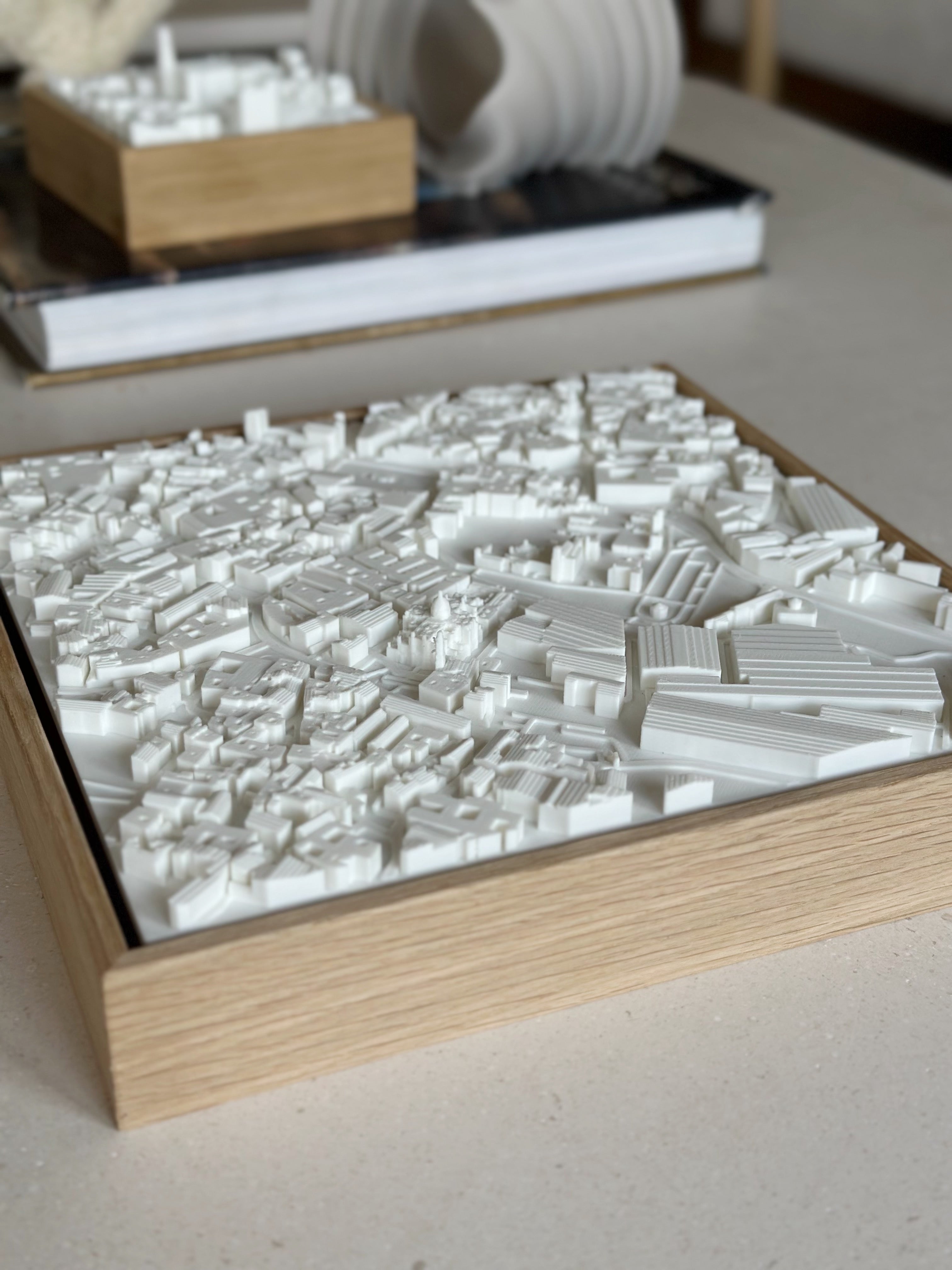 3D city map wall art in a wooden frame, modern home decor on a beige table