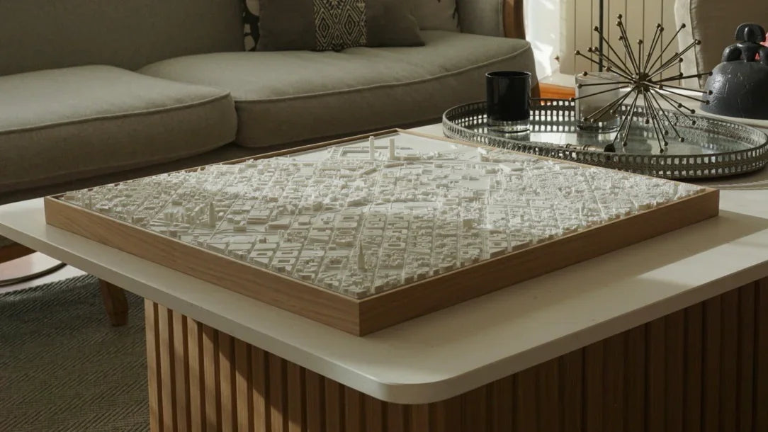 White 3D city map wall art displayed on a modern coffee table in a living room