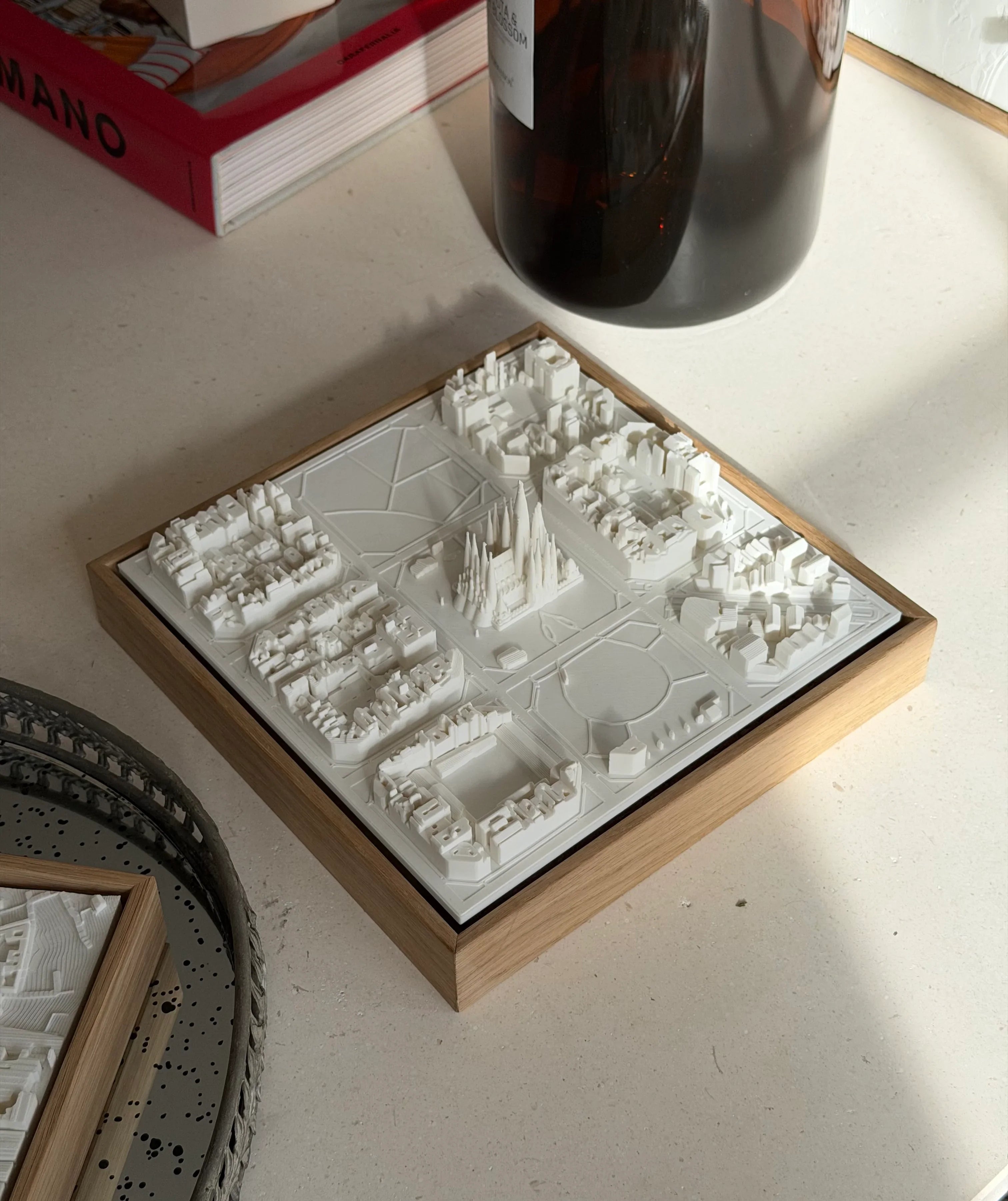3D city map art with white buildings in a wooden frame, decorative home decor piece