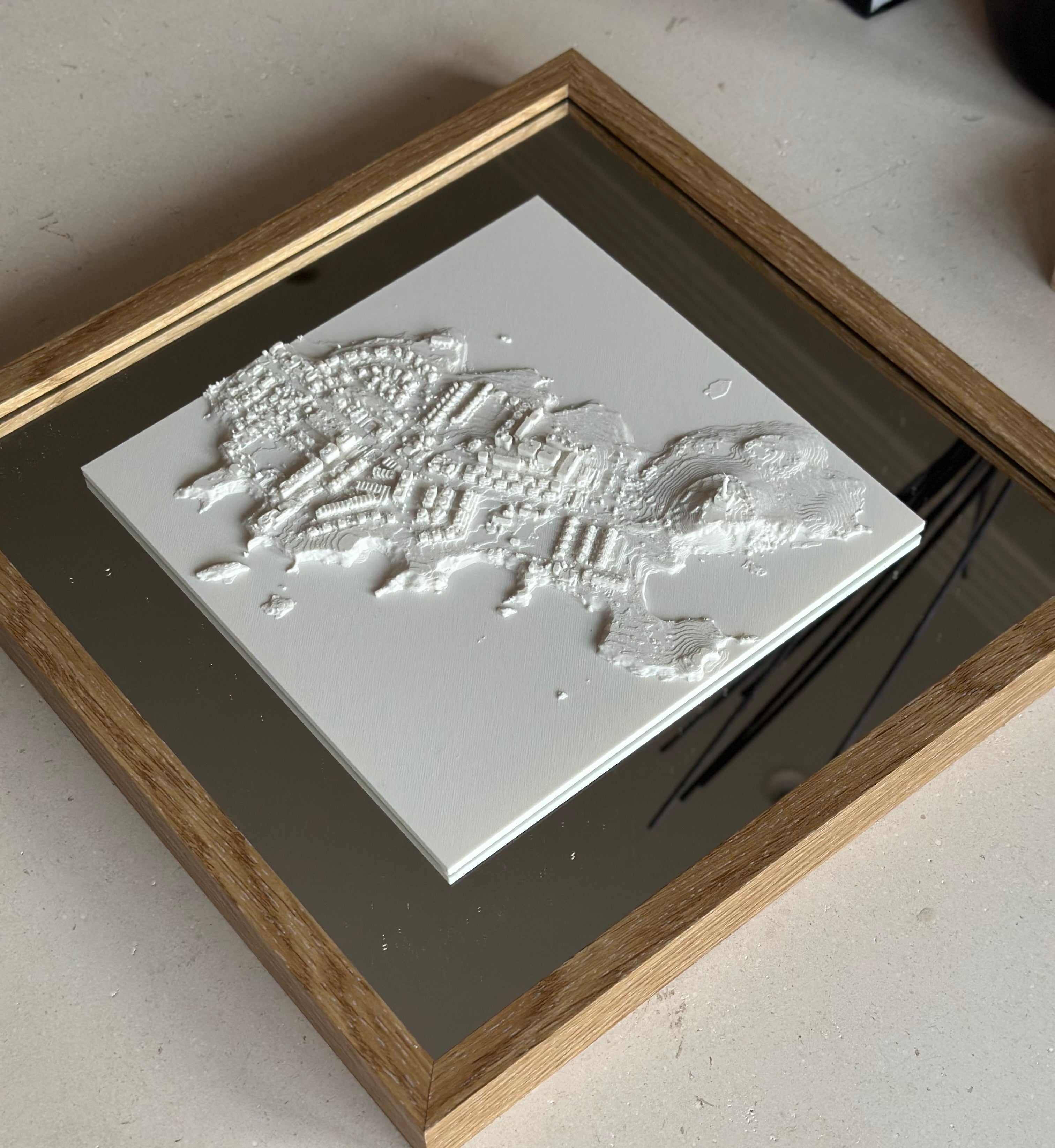3D city map wall art in a wooden frame on a mirror base, modern home decor