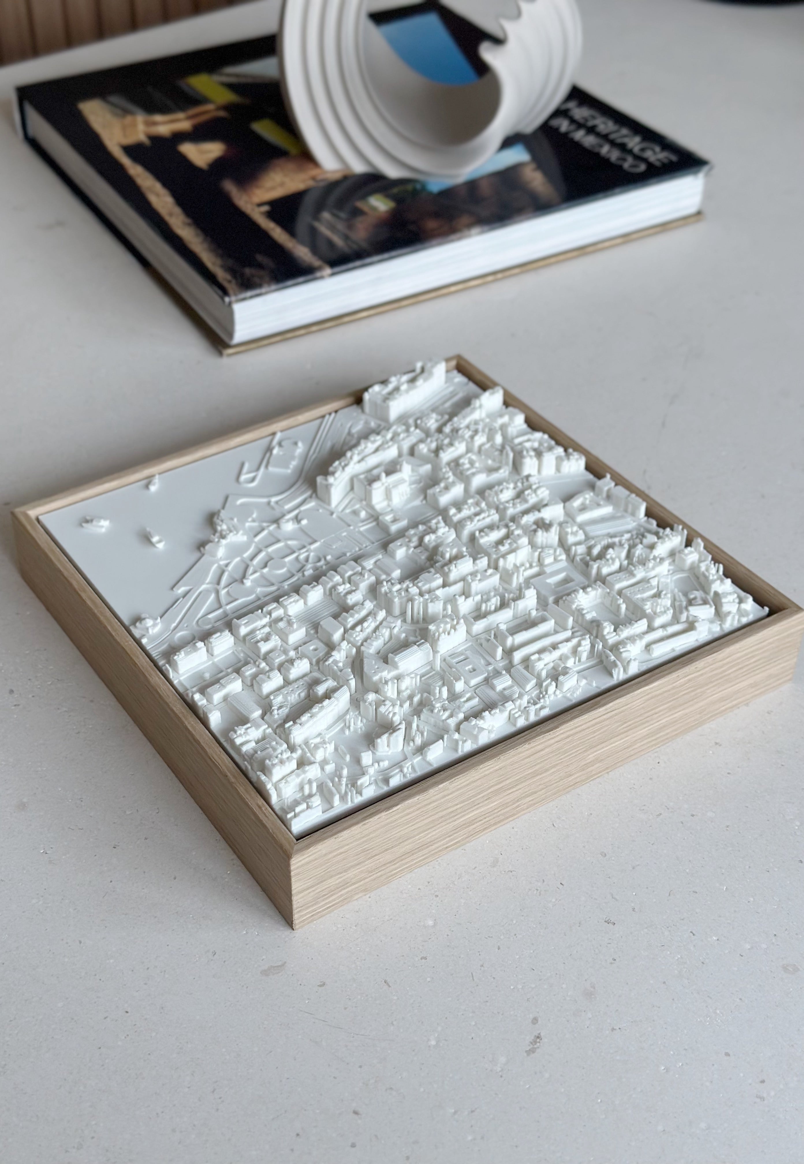 3D city map wall art in a wooden frame on a modern table, decorative home decor piece