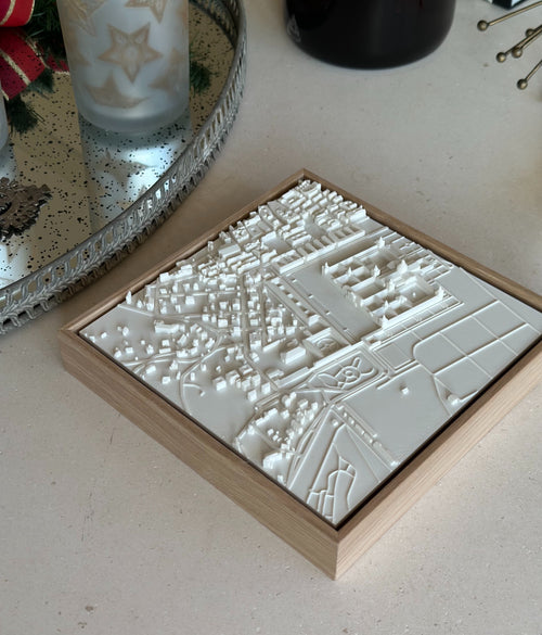 3D city map wall art in a wooden frame displayed on a modern table, decorative home decor