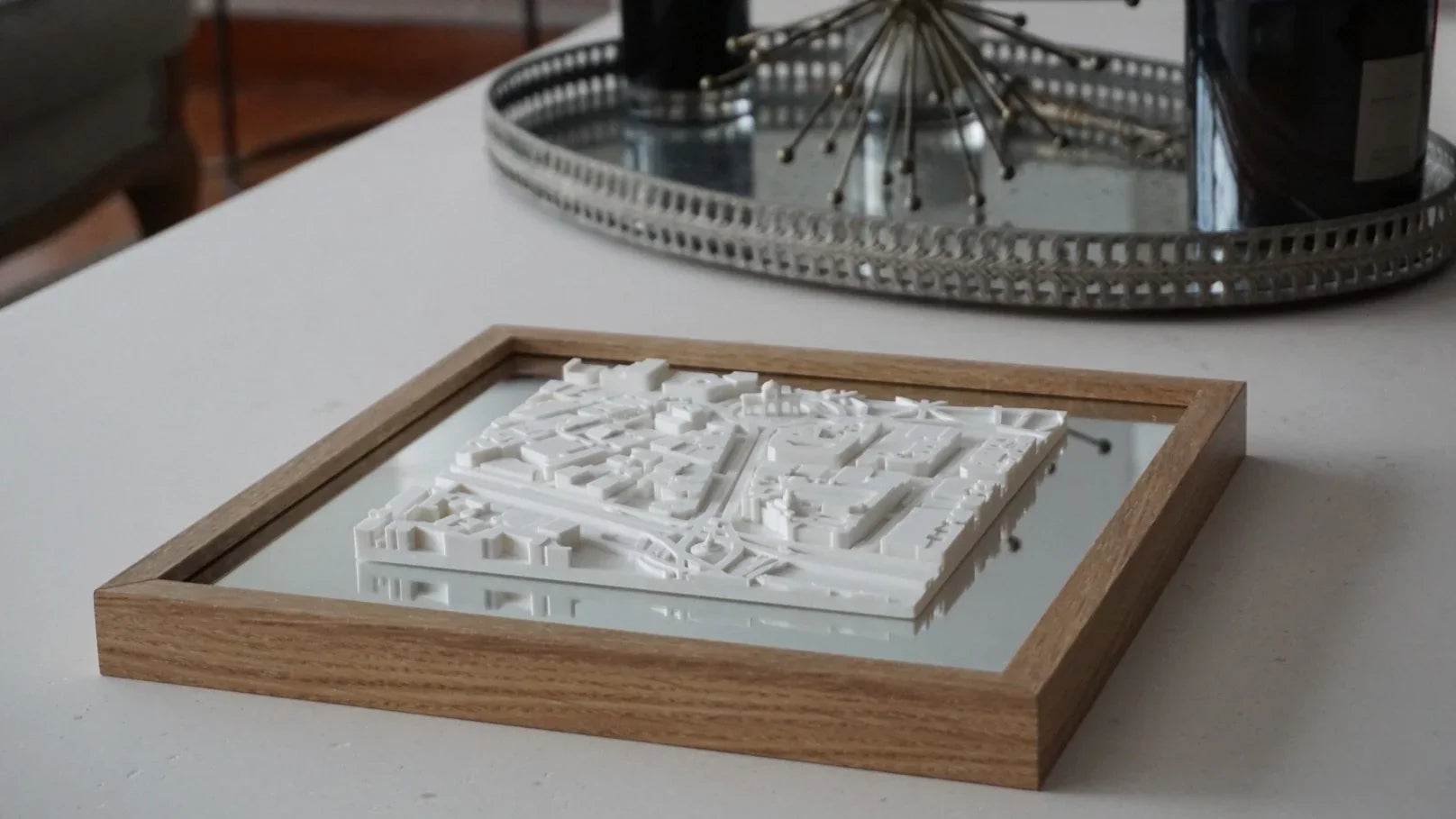 3D city map wall art in wooden frame on a modern table, stylish home decor