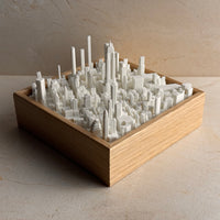 3D city skyline map model in a wooden frame, modern urban wall decor