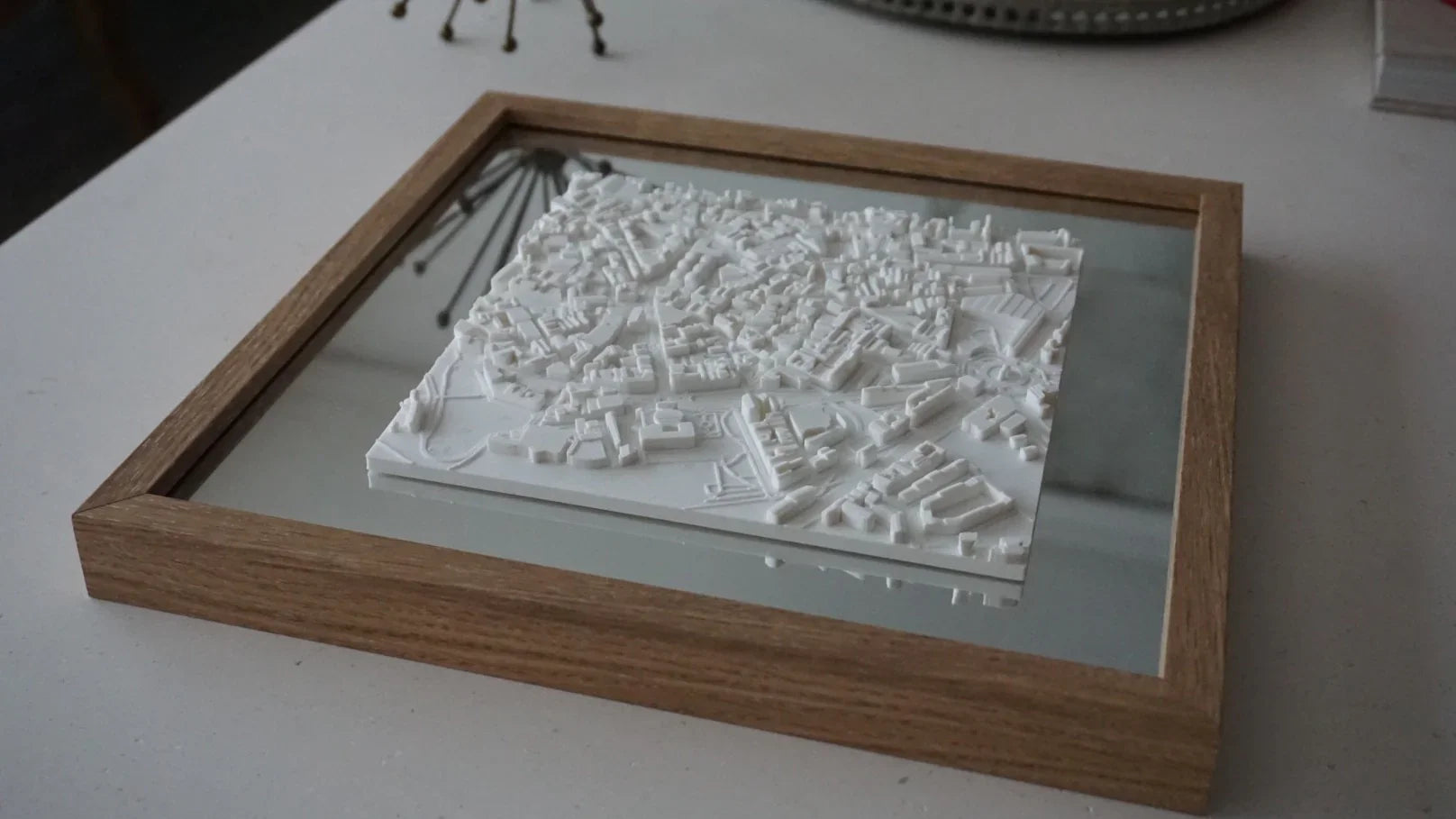 3D city map wall art in a wooden frame, decorative modern cityscape model