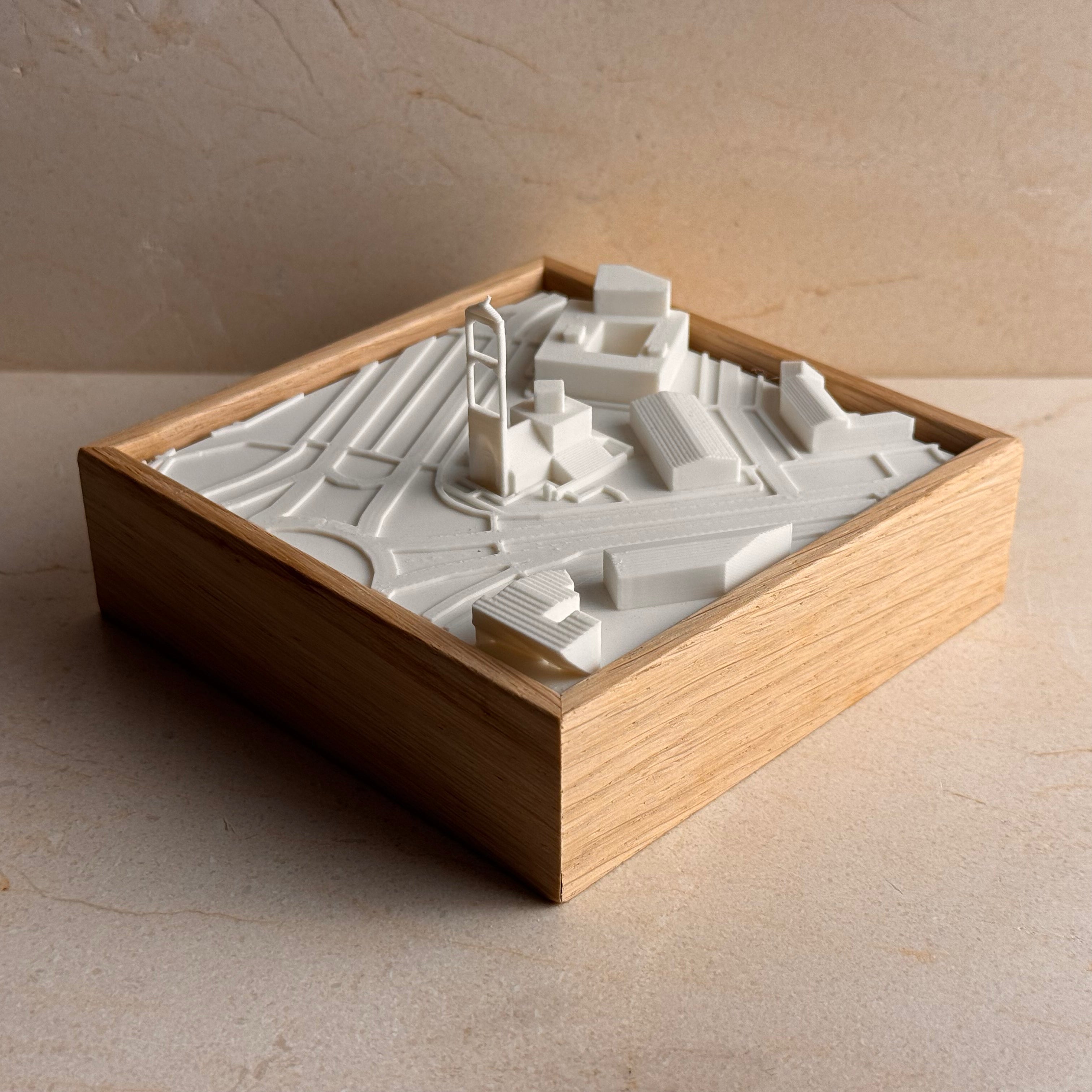 3D city map model in a wooden frame, minimalist urban decor for travelers