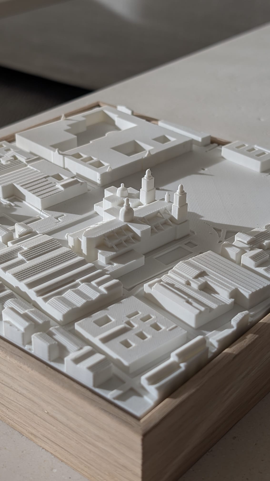 3D printed city map artwork with raised buildings in a wooden frame, modern urban decor