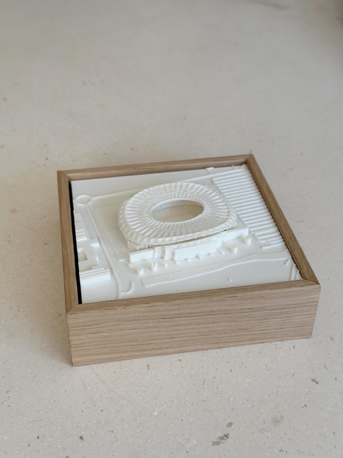 3D city map wall art in a wooden frame featuring a raised stadium model