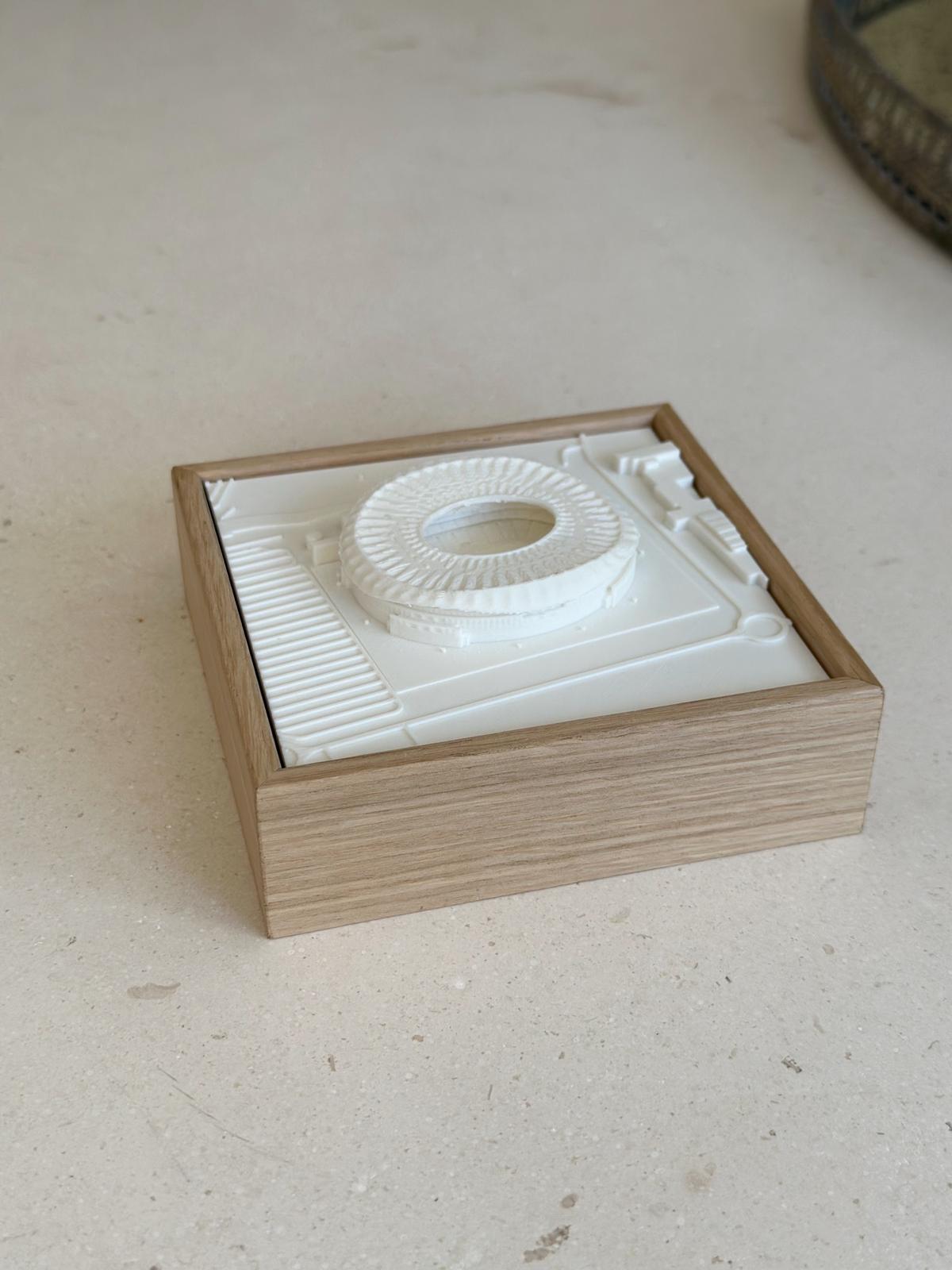 3D city map artwork featuring a detailed white stadium model in a wooden frame, modern decor